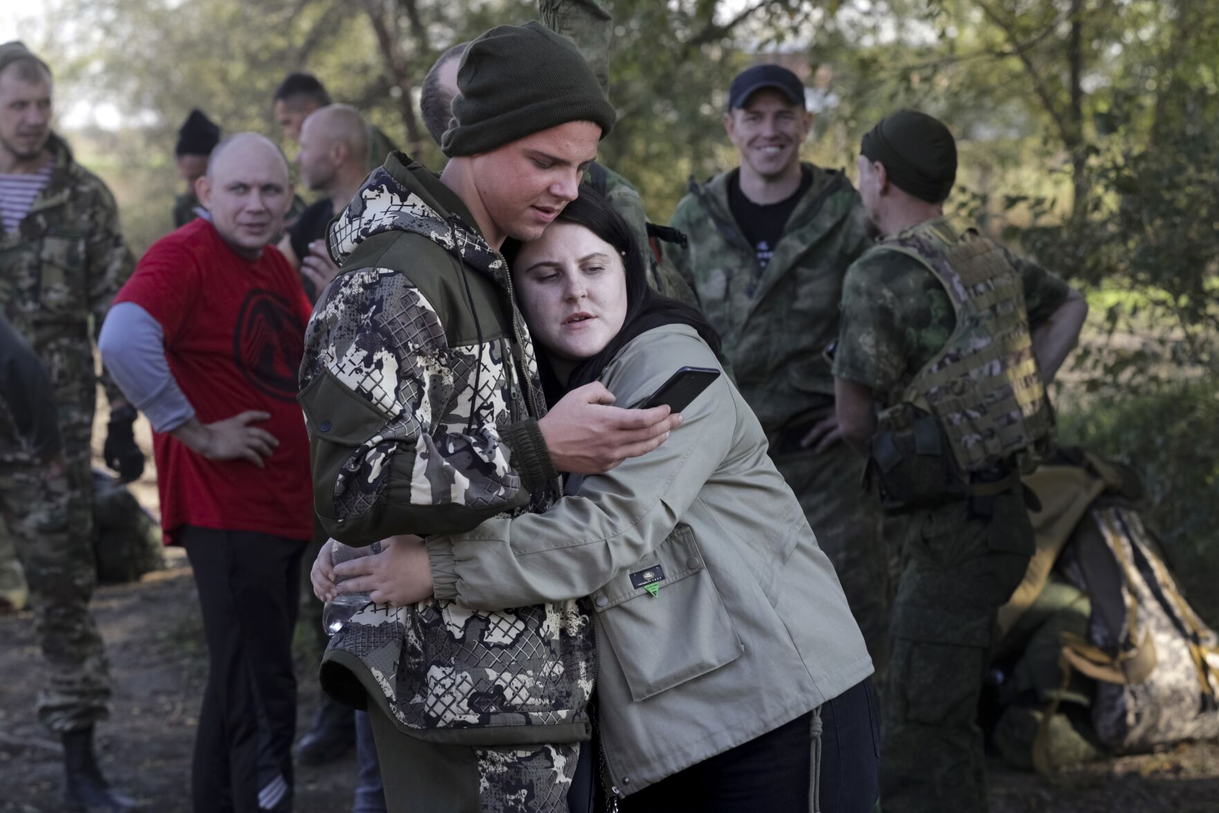 <p>A Russian recruit and his wife embrace at a railway station Sept. 29, 2022, in Prudboi, in Russia's Volgograd region.</p>