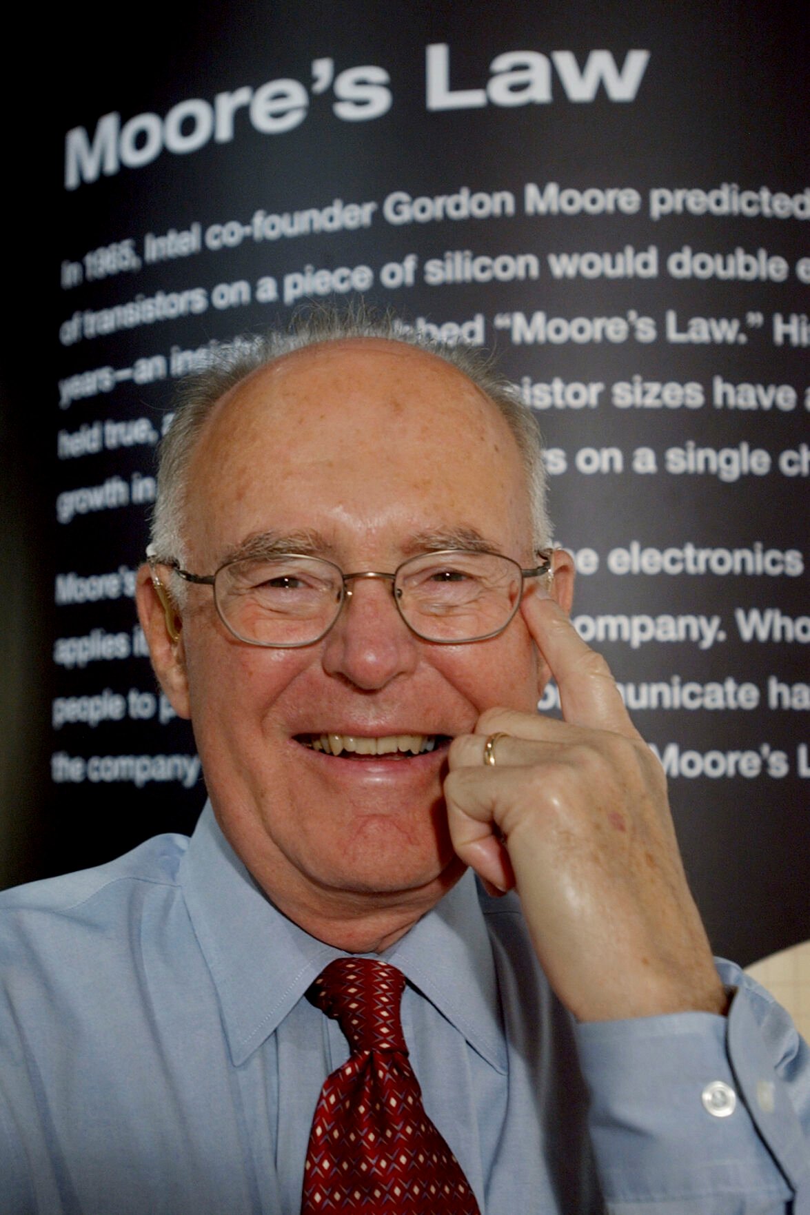 <p>FILE - Intel Corp. co-founder Gordon Moore smiles next to a wall at Intel headquarters in Santa Clara, Calif., Wednesday, March 9, 2005. Moore, the Intel Corp. co-founder who set the breakneck pace of progress in the digital age with a simple 1965 prediction of how quickly engineers would boost the capacity of computer chips, has died. He was 94. Intel and the Gordon and Betty Moore Foundation say Moore died Friday, March 24, 2023 at his home in Hawaii. (AP Photo/Paul Sakuma, File)</p>