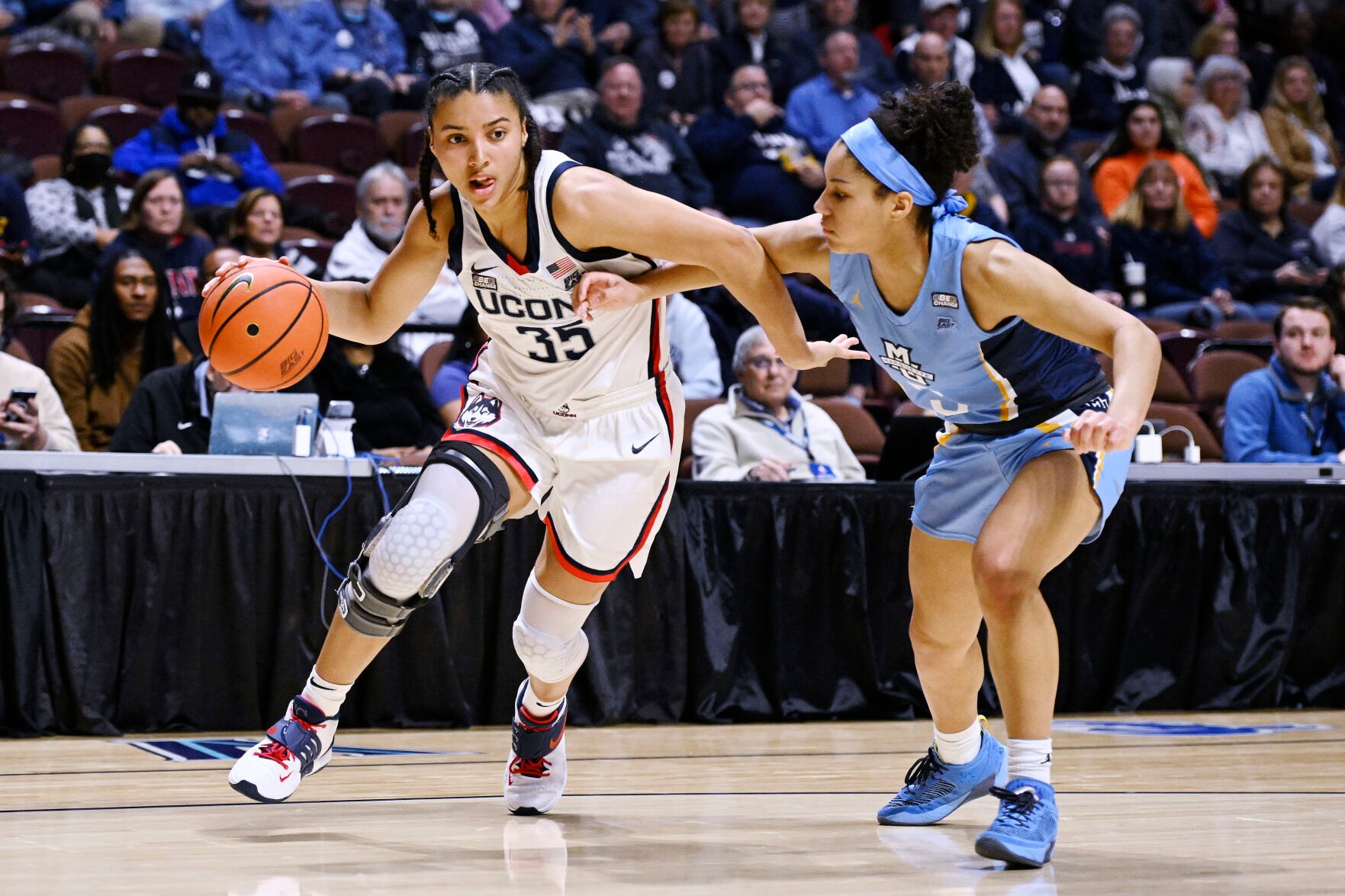 <p>UConn's Azzi Fudd is guarded by Marquette's Rose Nkumu during their game in the semifinals of the Big East Conference tournament at Mohegan Sun Arena on March 5.</p>