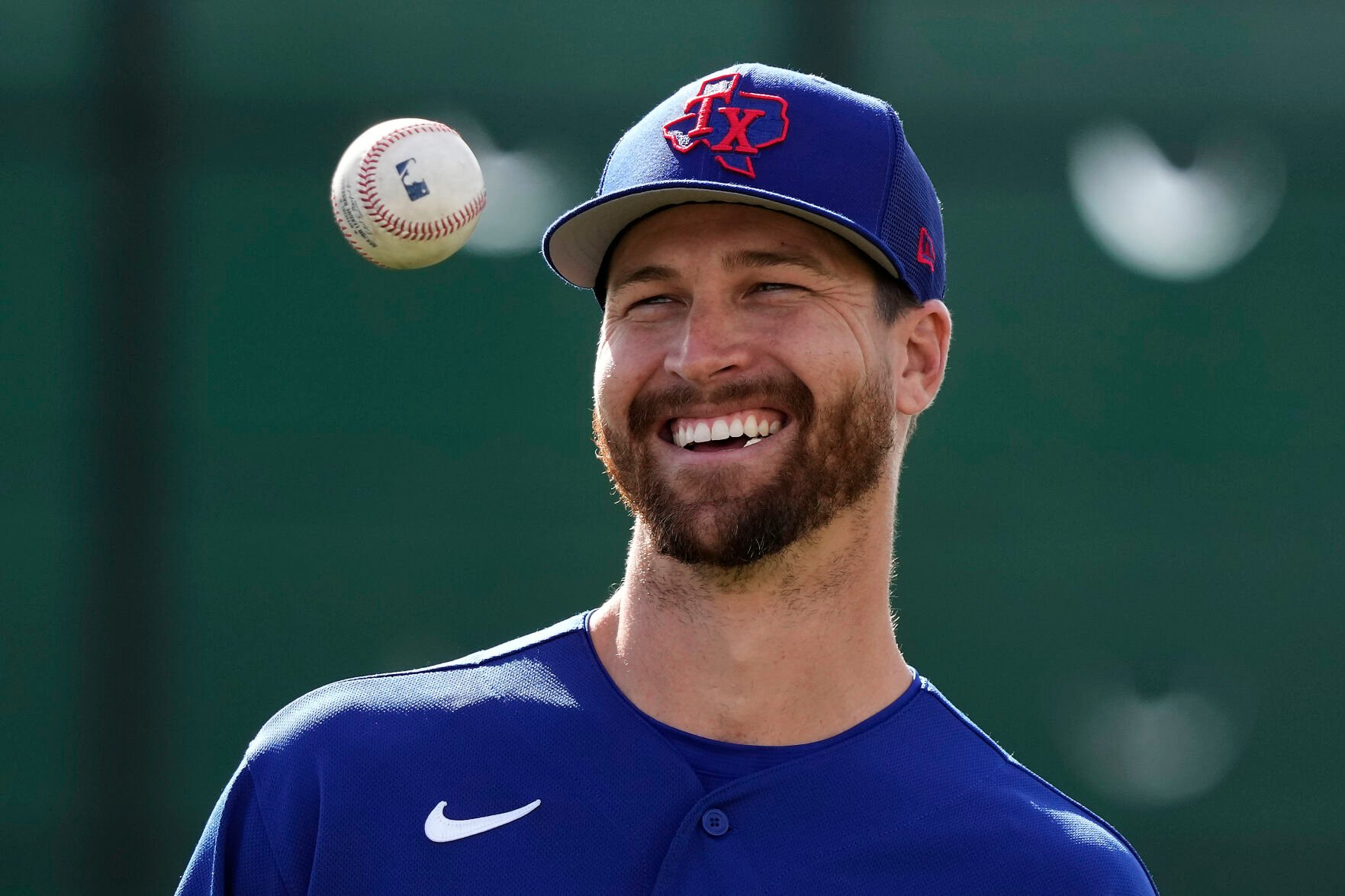 <p>Texas Rangers pitcher Jacob deGrom waits to throw during a spring training baseball practice on Feb. 19 in Surprise, Ariz.</p>