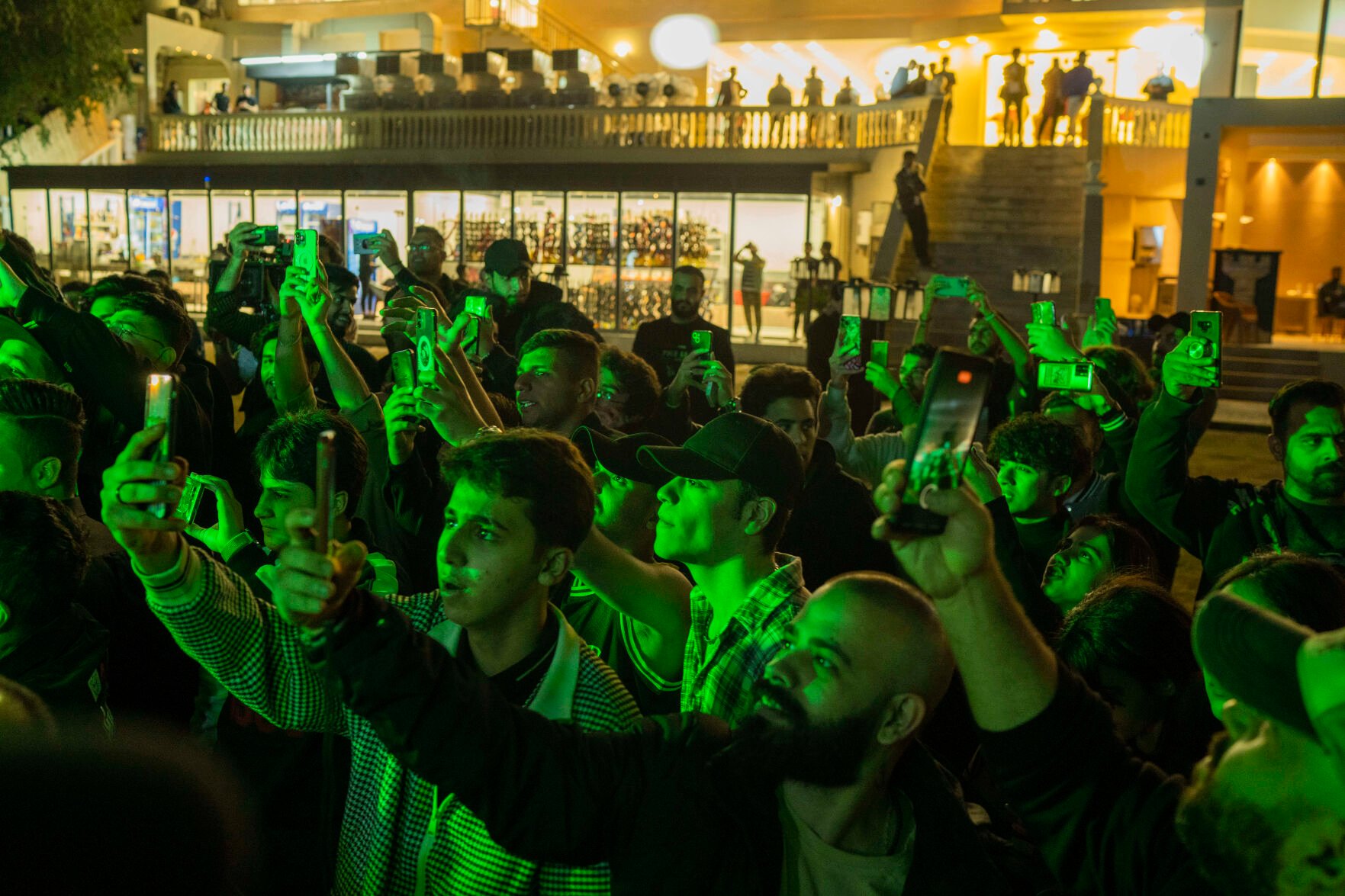 <p>Youths gather along the Tigris River for a concert by rap artist OG Khalifa in Baghdad, Iraq, Saturday Feb. 25, 2023. One of the songs he performed mocks “sheikhs,” those who wield power in the new Iraq through wealth or political connections. (AP Photo/Jerome Delay)</p>