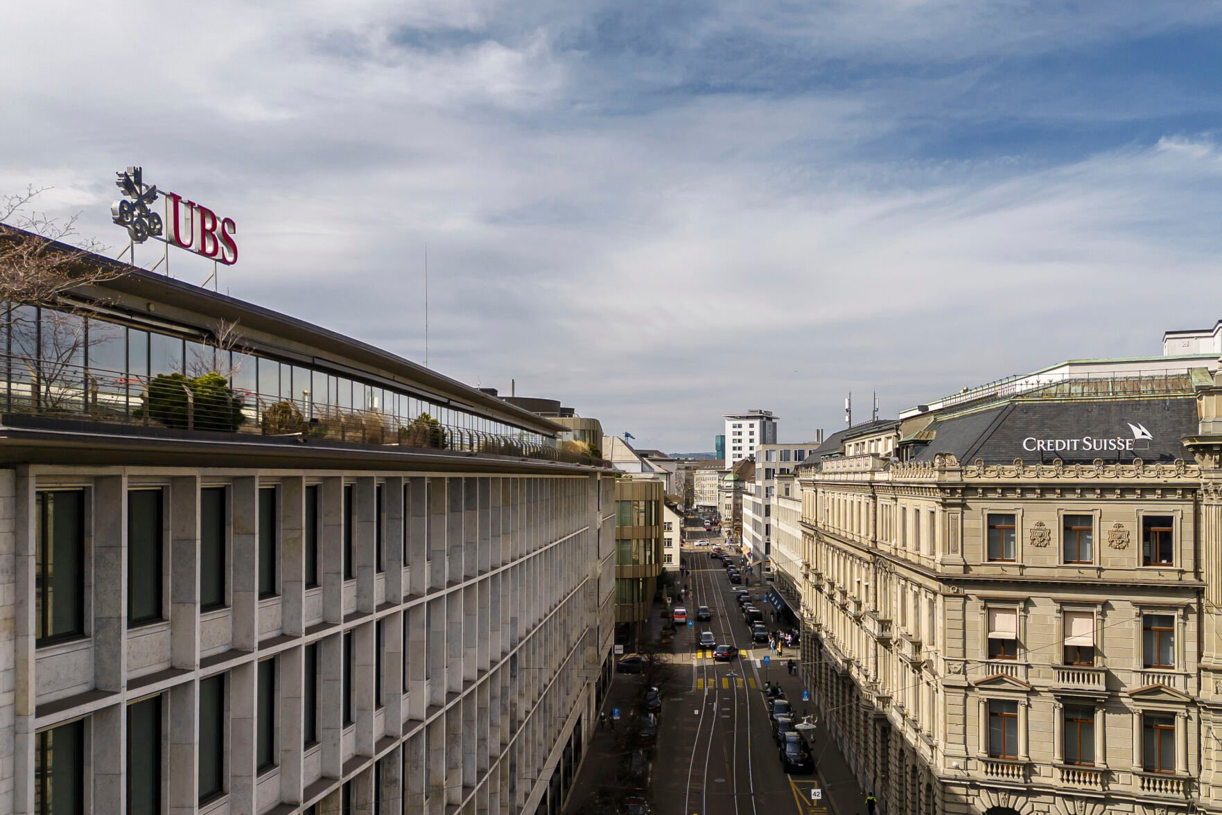 <p>A general view shows the headquarters of the Swiss bank Credit Suisse, right, and UBS, left, Saturday at Paradeplatz in Zurich, Switzerland.</p>