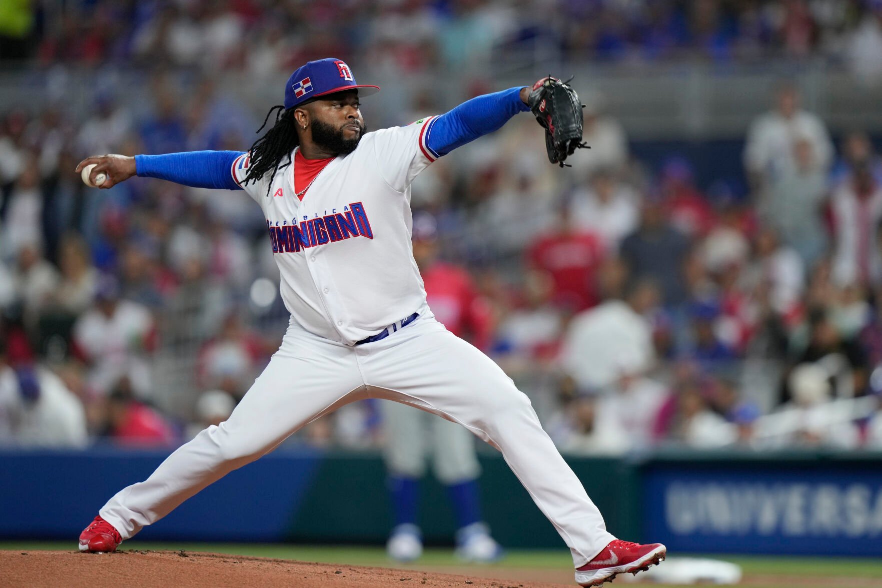 <p>Johnny Cueto pitches for the Dominican Republic in a WBC game against Puerto Rico on March 15 in Miami.</p>