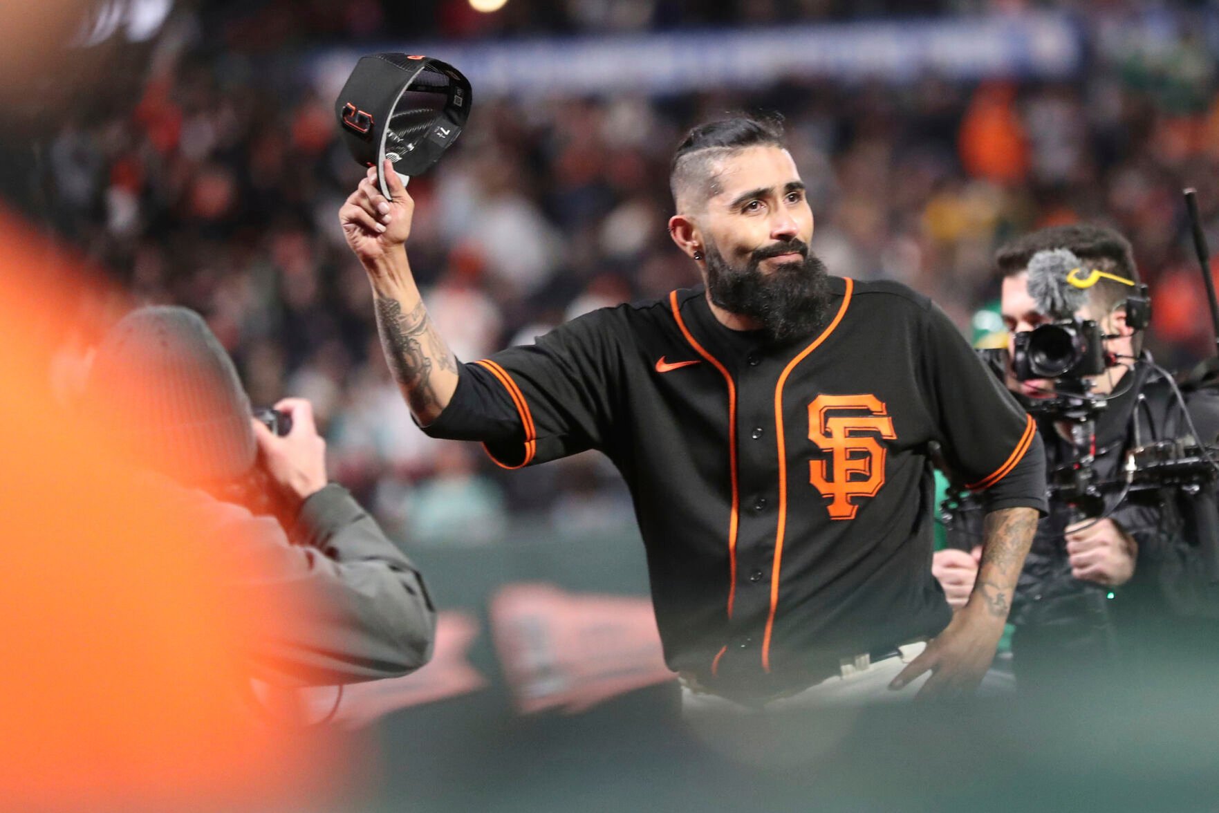 <p>San Francisco Giants reliever Sergio Romo tips his cap after the final relief appearance of his career during Monday's spring training game against the Oakland Athletics at Oracle Park in San Francisco.</p>