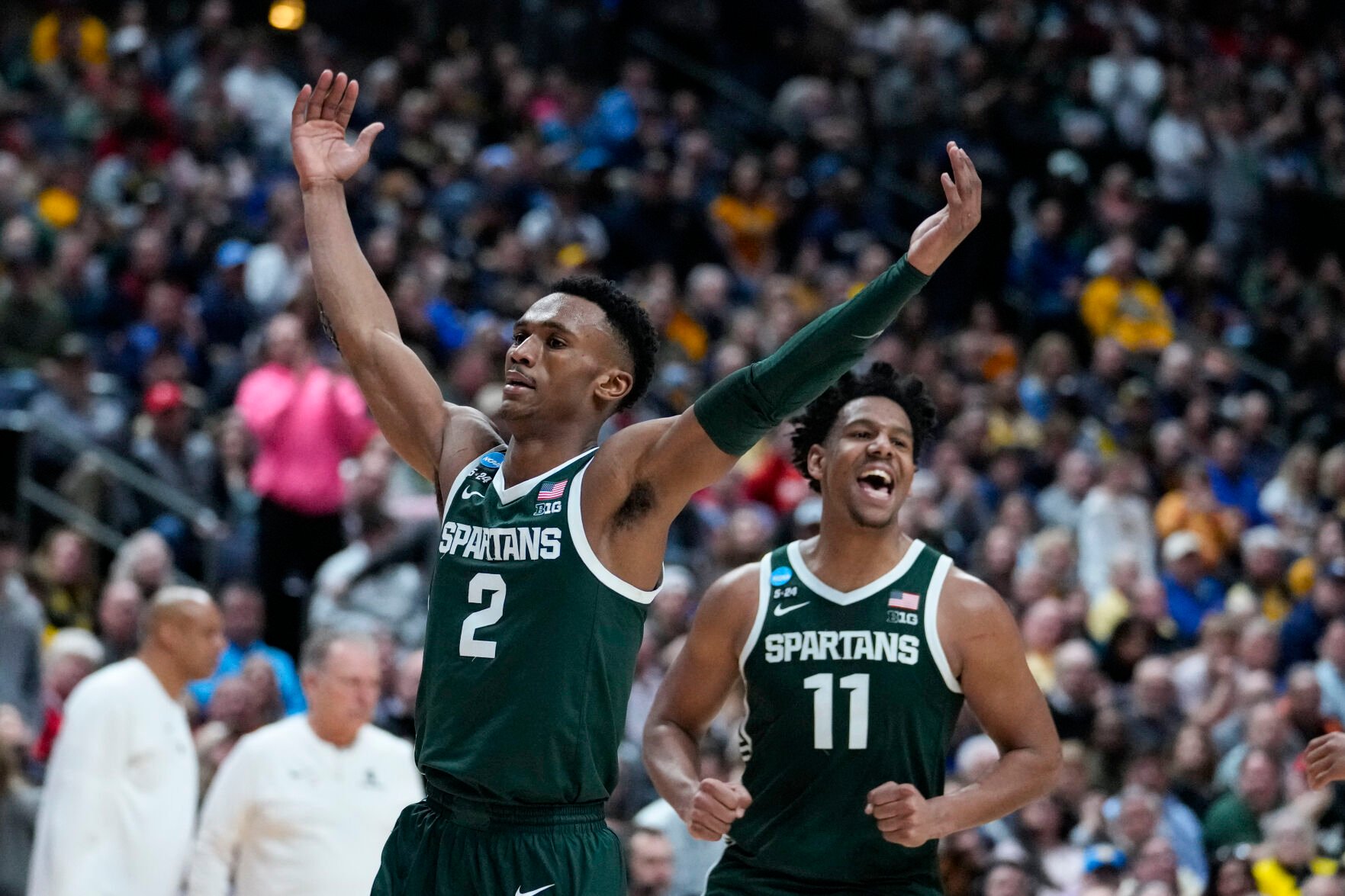 <p>Michigan State guard Tyson Walker, left, and guard A.J. Hoggard celebrate defeating Marquette in their second-round game of the men's NCAA Tournament on Sunday.</p>