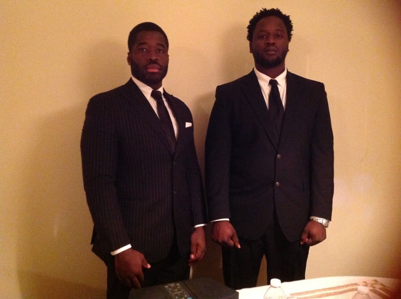 <p>Irvo N. Otieno, right, is pictured with his older brother, Leon Ochieng, at their father's funeral in 2015.</p>