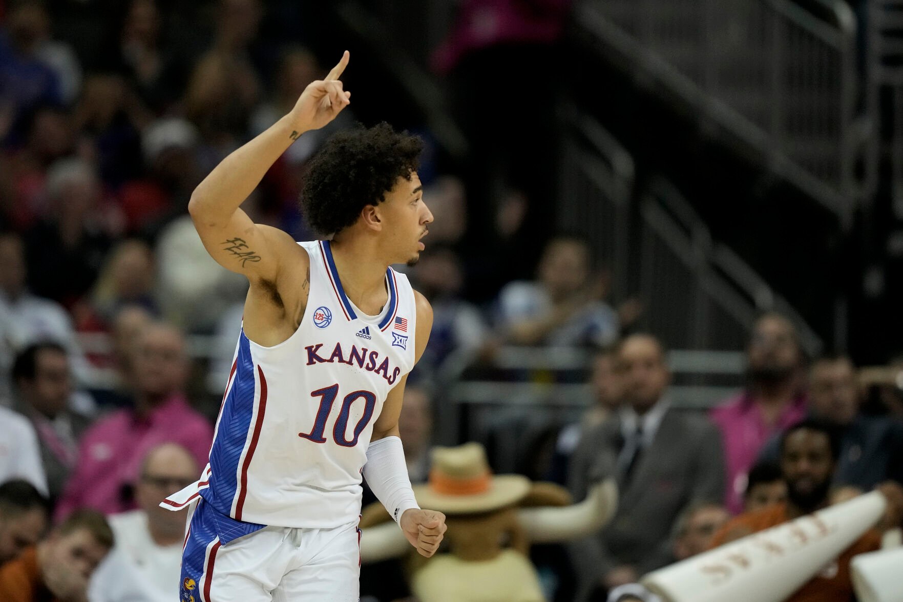 <p>Kansas forward Jalen Wilson celebrates after making a basket during the first half of Saturday's Big 12 Tournament championship game against Texas in Kansas City, Mo.</p>
