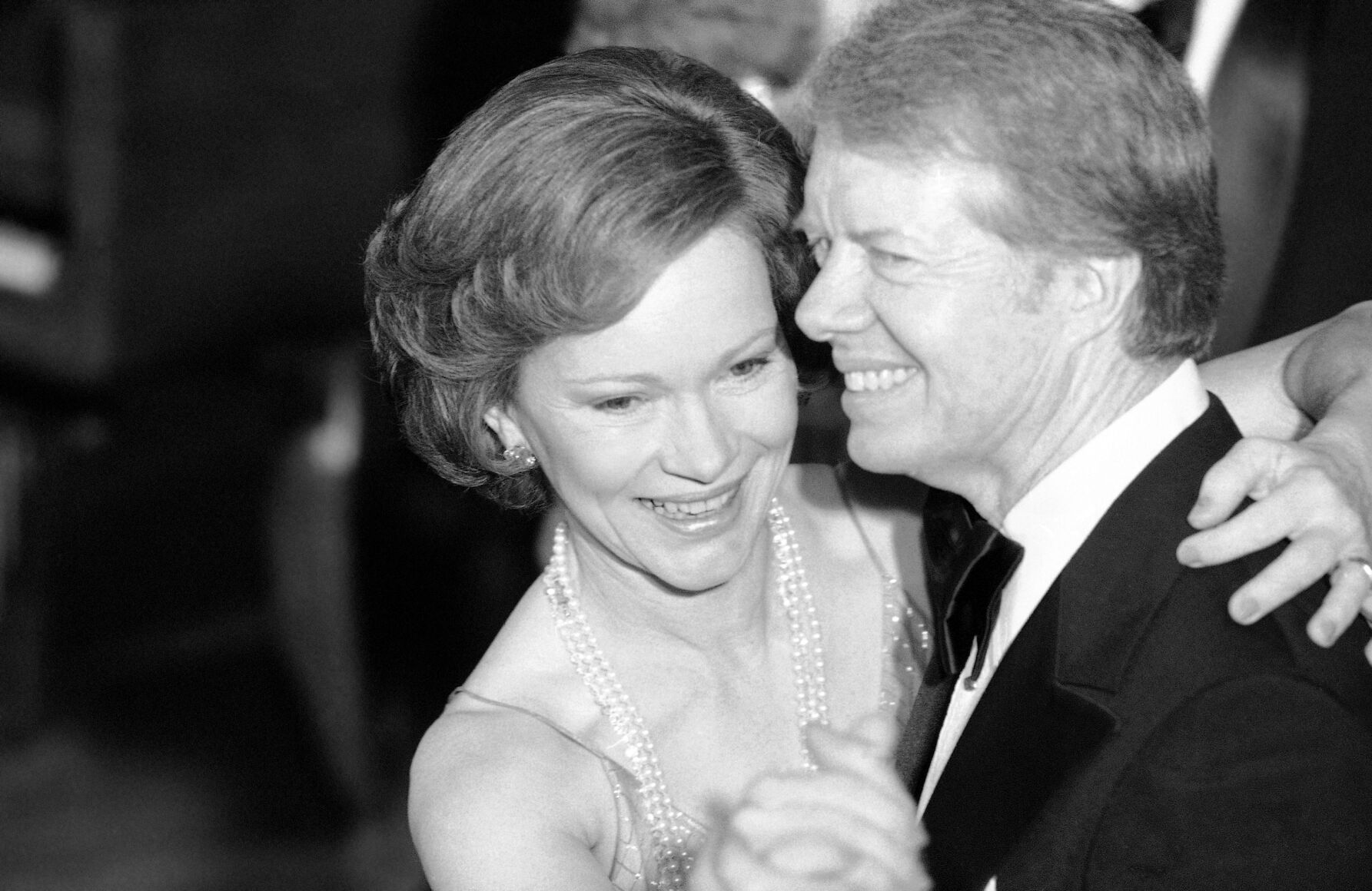 <p>FILE - U.S. President Jimmy Carter and his wife, Rosalynn, lead their guests in dancing at the annual Congressional Christmas Ball at the White House in Washington, Dec. 13, 1978. </p>