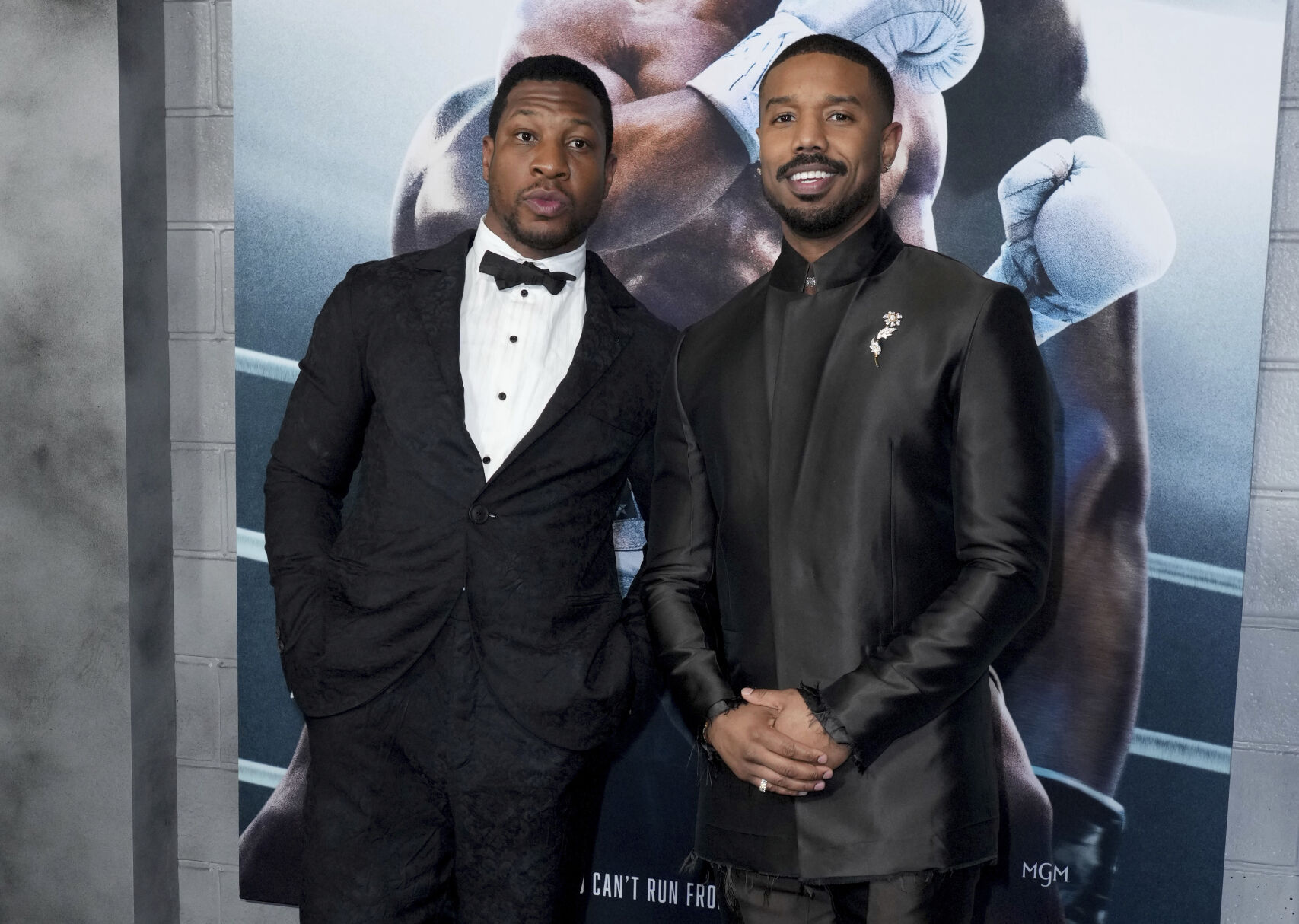<p>Jonathan Majors, left, and Michael B. Jordan arrive at the premiere of "Creed III" on Monday, Feb. 27, 2023, at TCL Chinese Theatre in Los Angeles. (Photo by Jordan Strauss/Invision/AP)</p>