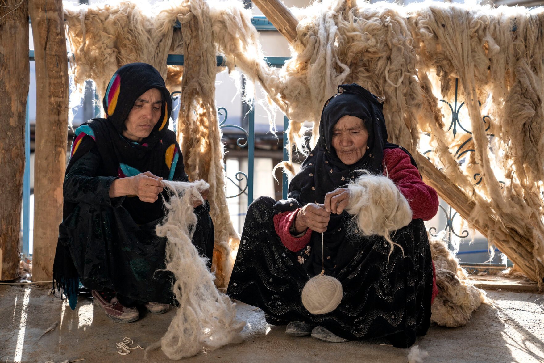 <p>Afghan women weave wools for making carpets Monday at a traditional carpet factory in Kabul, Afghanistan.</p>