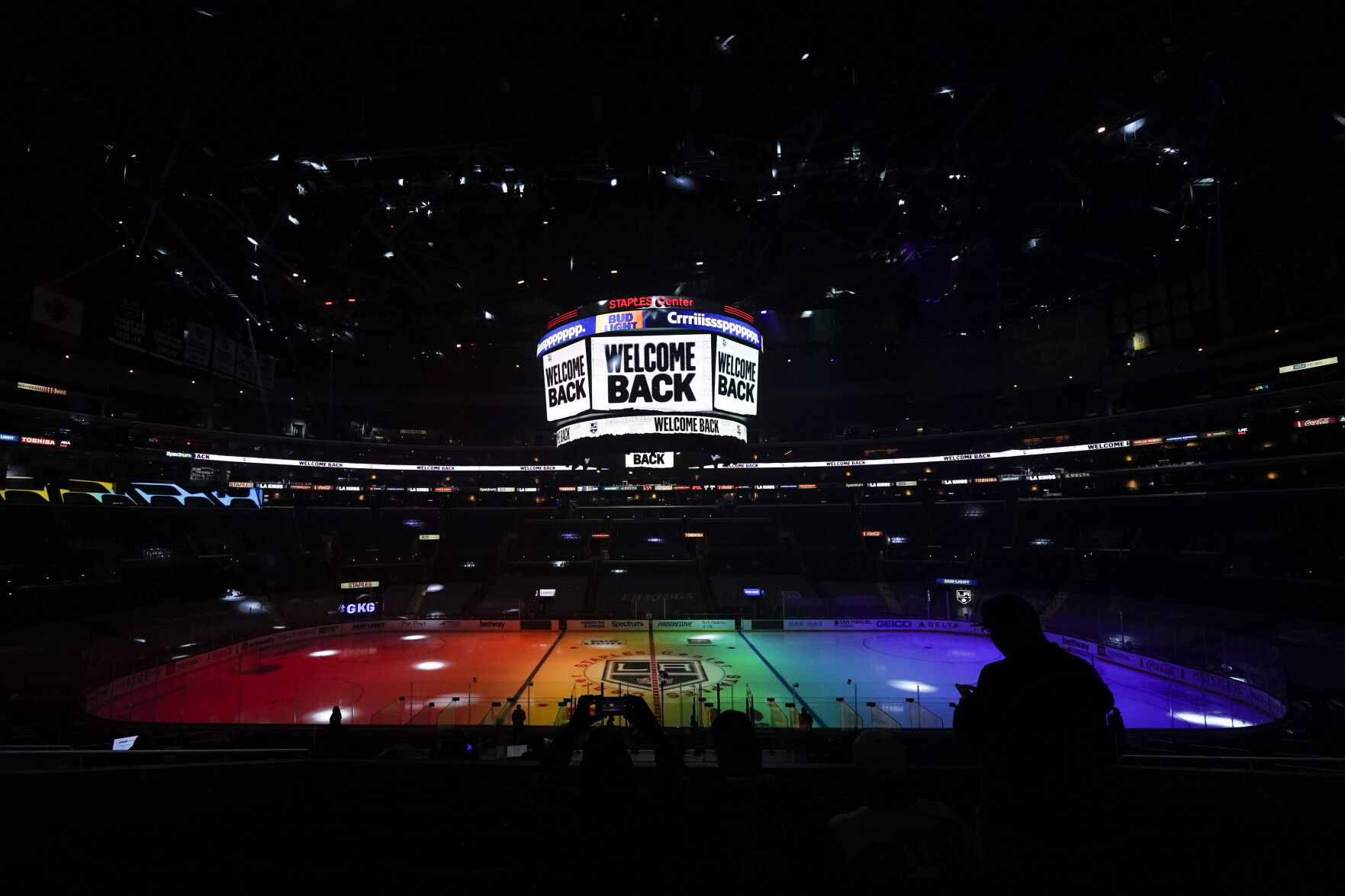 <p>FILE - The ice is lit in rainbow light for Pride Night before an NHL hockey game between the Anaheim Ducks and the Los Angeles Kings, Monday, April 26, 2021, in Los Angeles. </p>