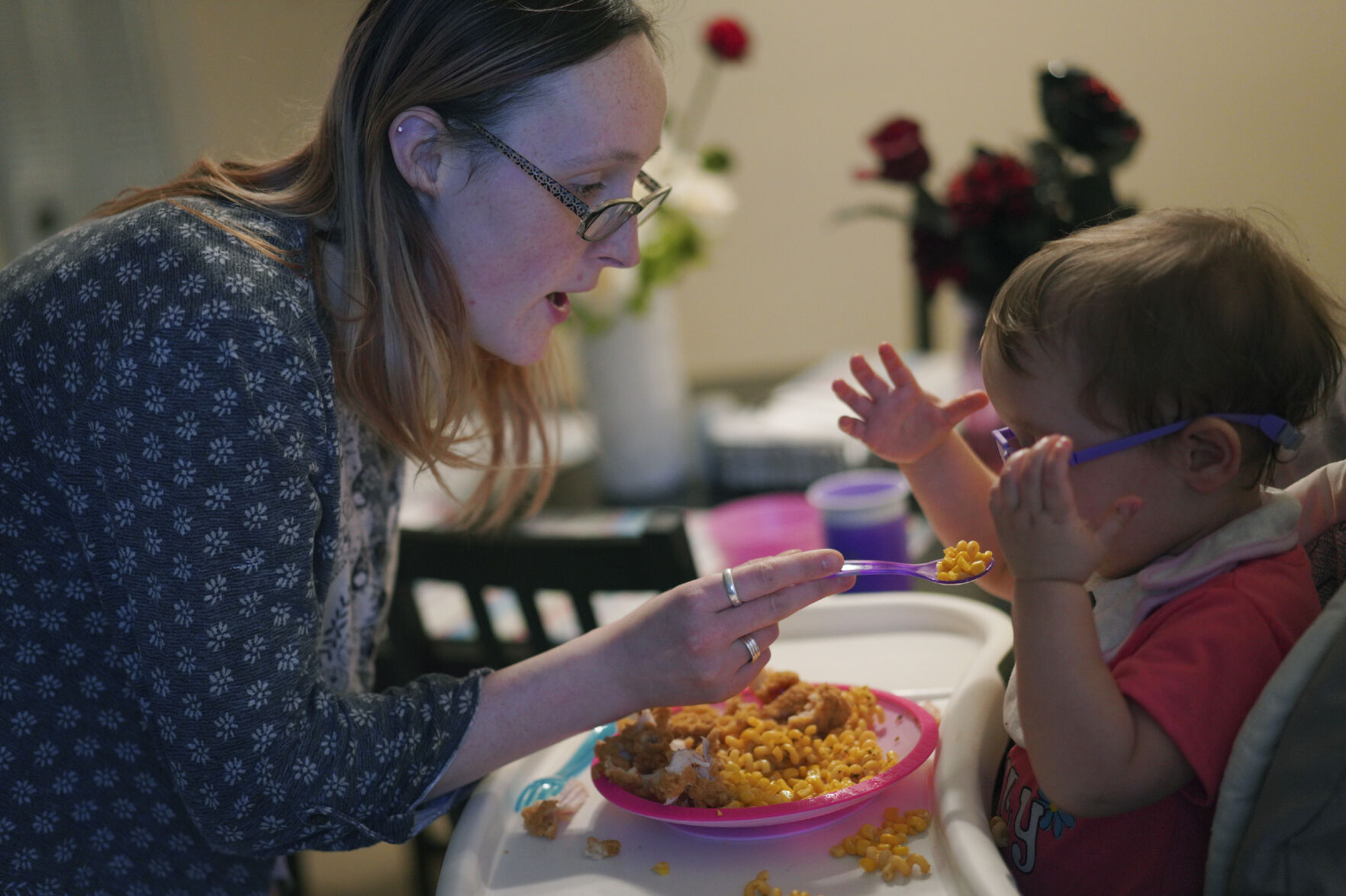 <p>Lauren Hackney feeds her 1-year-old daughter chicken and macaroni during a supervised visit Nov. 17 at their apartment in Oakdale, Pa. Lauren and her husband, Andrew, wonder if their daughter’s own disability may have been misunderstood in the child welfare system. The girl was recently diagnosed with a disorder that can make it challenging for her to process her sense of taste, which they now believe likely contributed to her eating issues.</p>