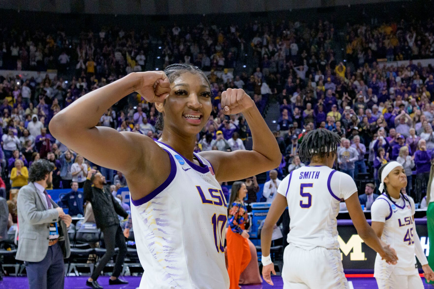 <p>LSU forward Angel Reese flexes after LSU defeated Michigan in Sunday's second-round game in Baton Rouge, La.</p>