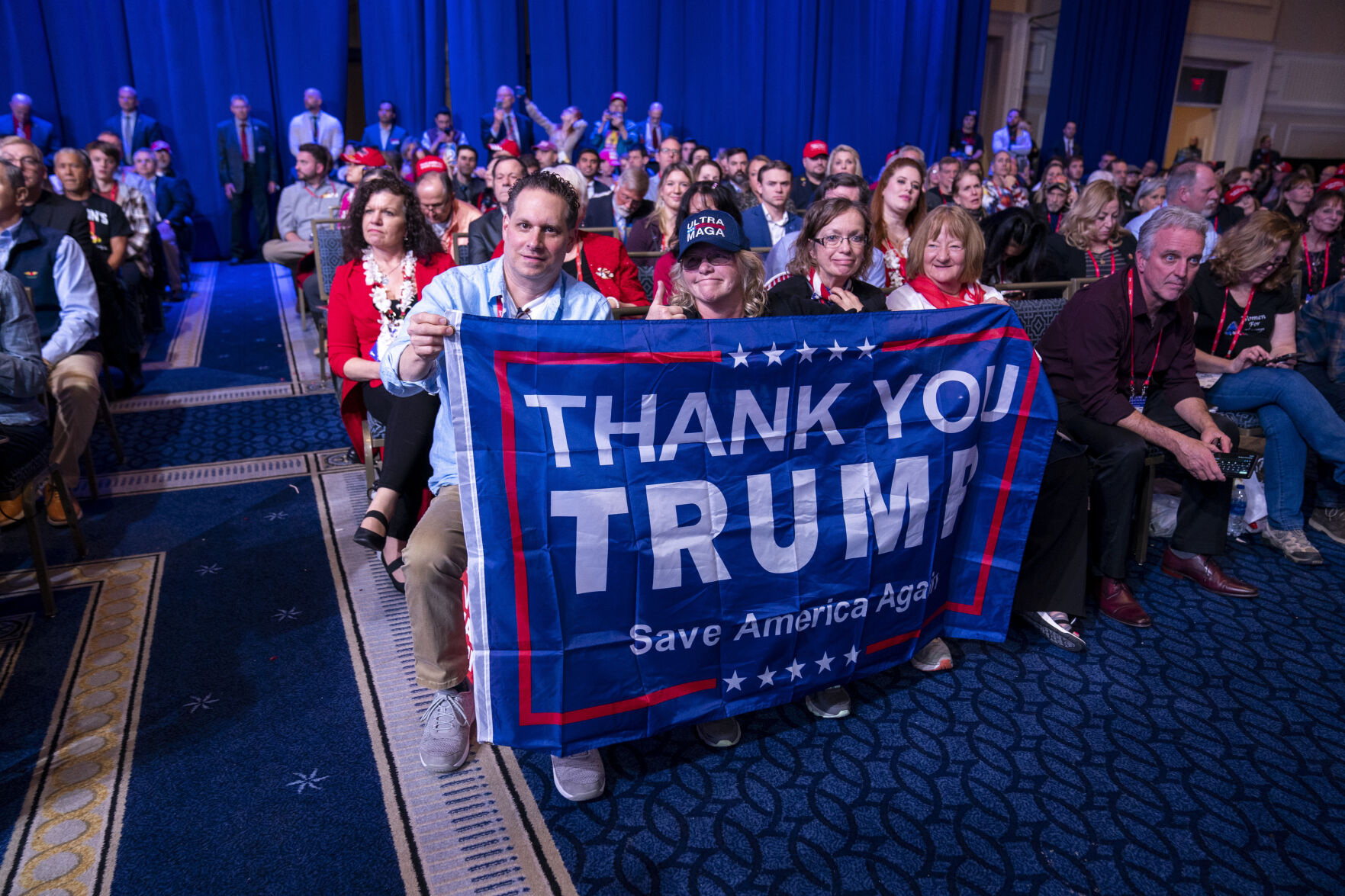 <p>Supporters hold a flag as former President Donald Trump speaks at the Conservative Political Action Conference, CPAC 2023, Saturday, March 4, 2023, at National Harbor in Oxon Hill, Md. (AP Photo/Alex Brandon)</p>