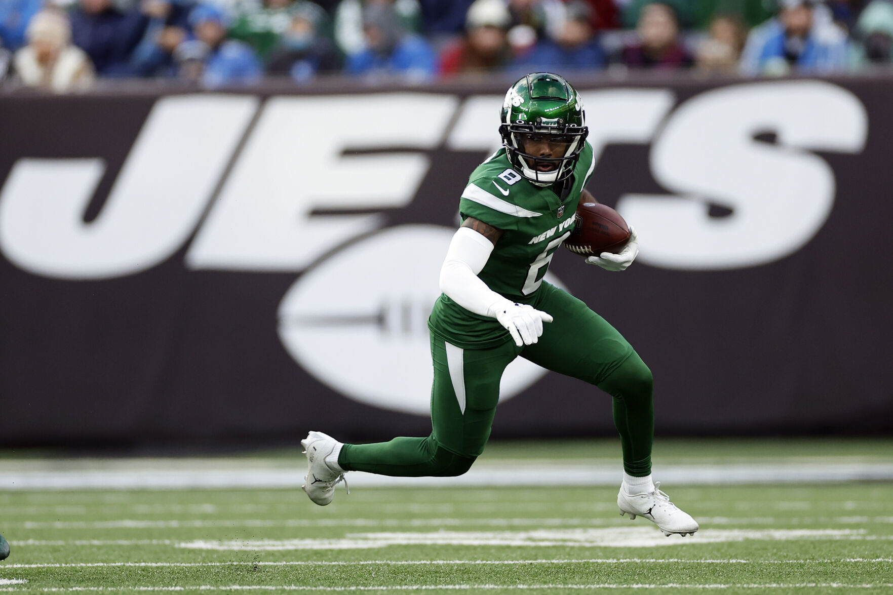 <p>Former New York Jets wide receiver Elijah Moore runs with the ball against the Detroit Lions on Dec. 18 in East Rutherford, N.J.</p>