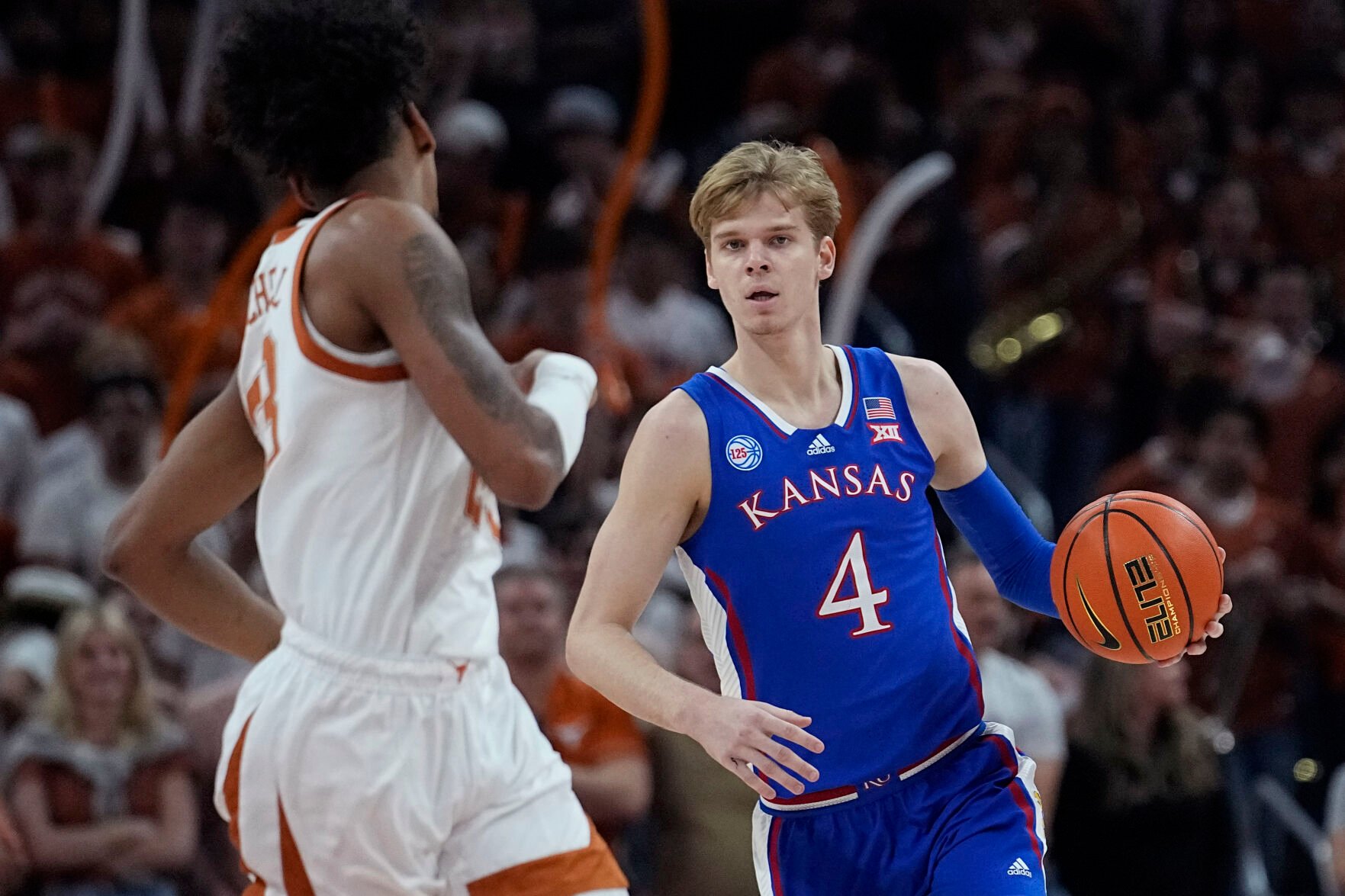 <p>Kansas guard Gradey Dick (4) brings the ball up court against Texas forward Dillon Mitchell (23) during the first half of a March 4 game in Austin, Texas.</p>