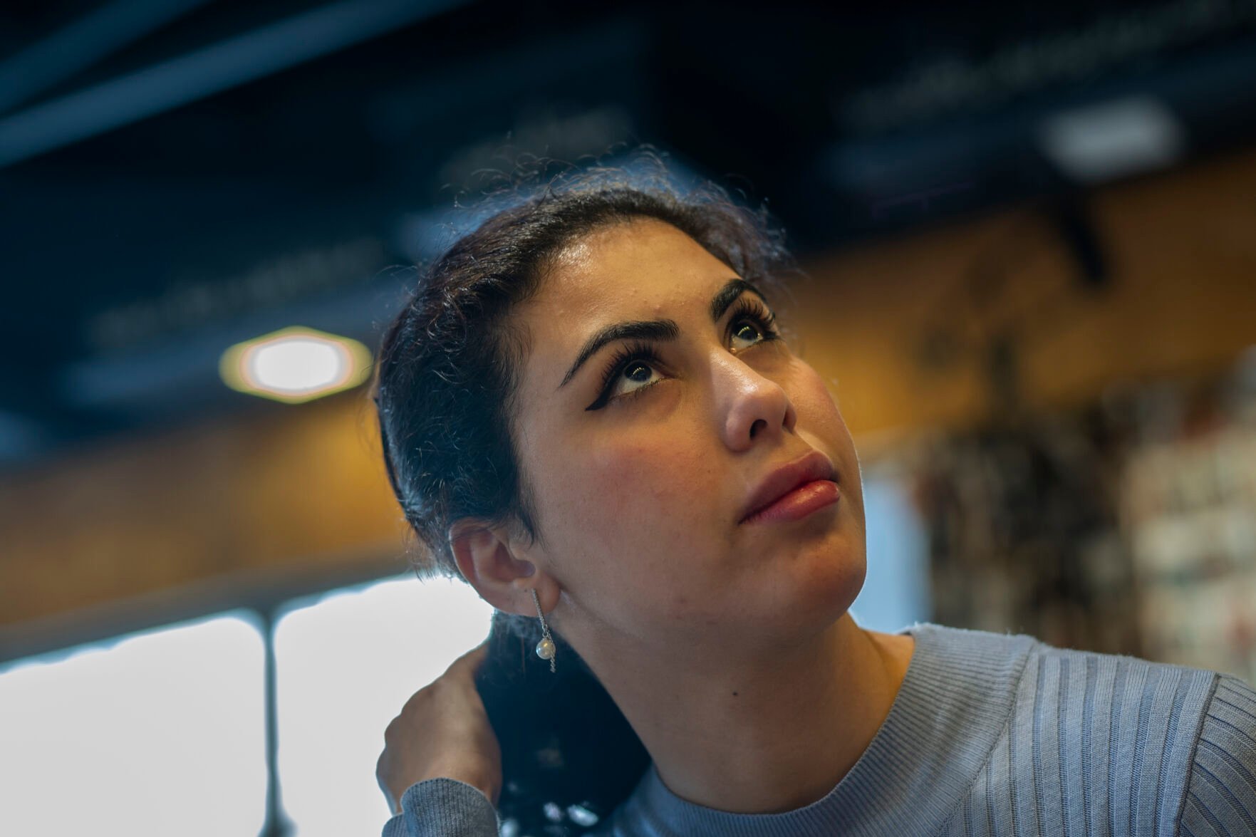 <p>Noor Alhuda Saad, 26, a Ph.D. candidate at Mustansiriya University who describes herself as a political activist, sits in a Baghdad cafe on Wednesday, March 1, 2023. She says her generation has been leading protests decrying corruption, demanding services and seeking more inclusive elections -- and won’t stop till they’ve built a better Iraq. “The people in power do not see these as important issues for them to solve. And that is why we are active.” (AP Photo/Jerome Delay)</p>