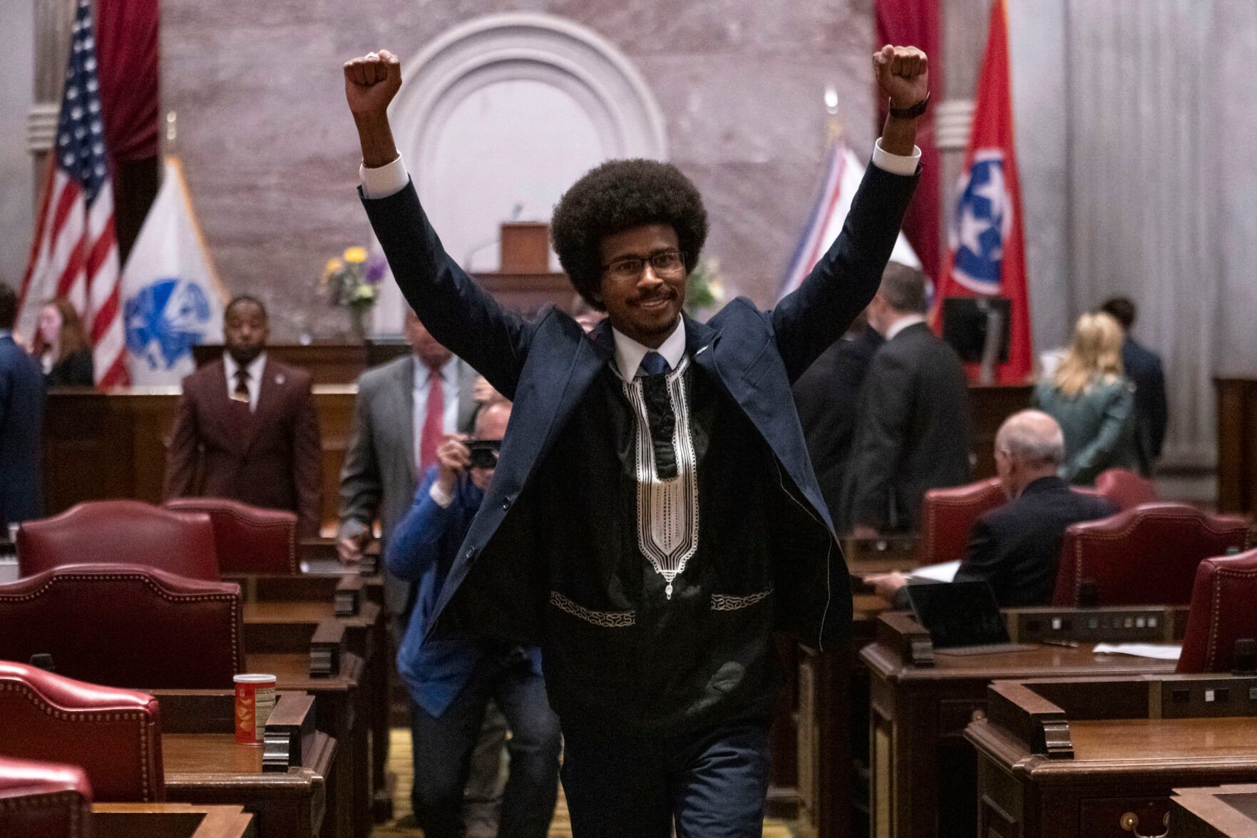<p>Former Rep. Justin Pearson, D-Memphis, raises his fists as he leaves the House chamber after he is expelled from the legislature Thursday, April 6, 2023, in Nashville, Tenn. Tennessee Republicans ousted two of three House Democrats for using a bullhorn to shout support for pro-gun control protesters in the House chamber. (AP Photo/George Walker IV)</p>