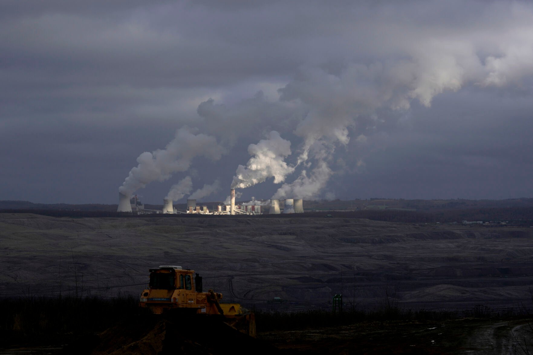 <p>Steam rises from a power plant located by the Turow lignite coal mine Jan. 15, 2022, near the town of Bogatynia, Poland.</p>