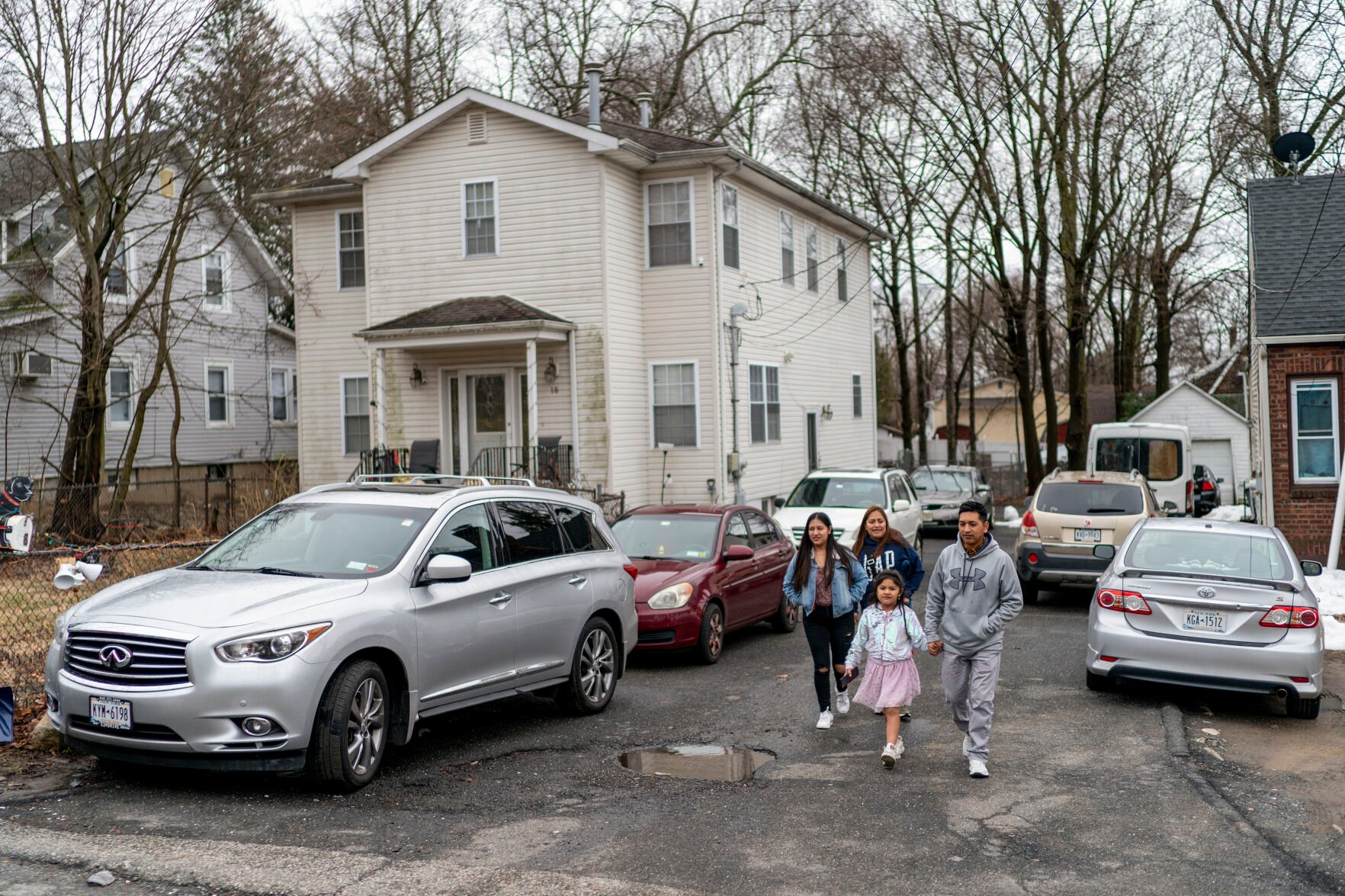 <p>Ecuadorian migrant Klever Ortega, right, leaves home for a shopping trip with members of his family March. 3 in Spring Valley, N.Y. </p>