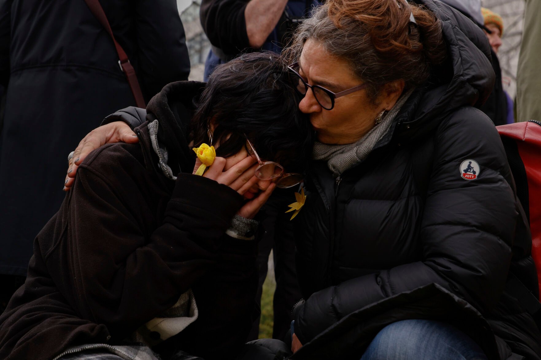 <p>Veronique Felenbok, right, daughter of ghetto survivor Paul Felenbok, hugs his son Alix on Wednesday as they attend personal unofficial observances marking the 80th anniversary of the Warsaw Ghetto Uprising in Warsaw, Poland.</p>