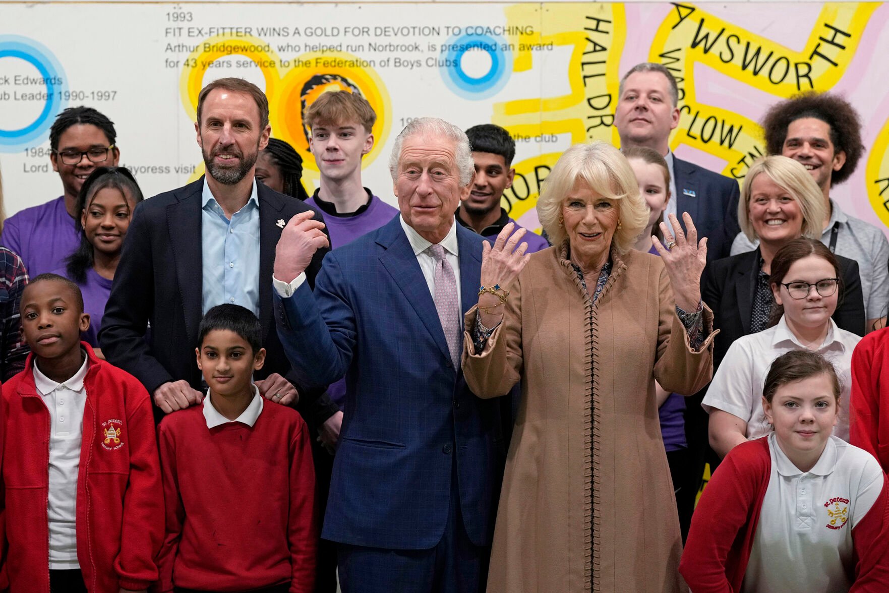 <p>Britain's King Charles III, center, and Camilla, the Queen Consort, center right, pose for a photograph Jan. 20 with England's national soccer coach and Prince's Trust ambassador Gareth Southgate, left, and children from St Peter's Primary School, during a visit to the Norbrook Community Centre, Wythenshawe, in Manchester, England.</p>