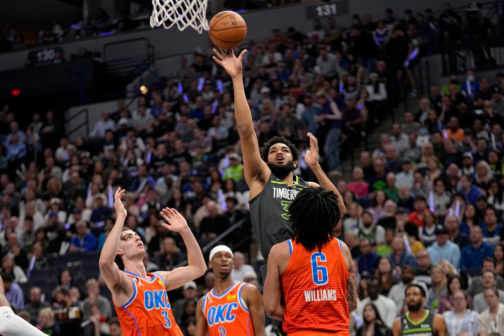 <p>Minnesota Timberwolves center Karl-Anthony Towns shoots against Oklahoma City Thunder forward Jaylin Williams (6) during the first half of Friday's play-in tournament game in Minneapolis.</p>