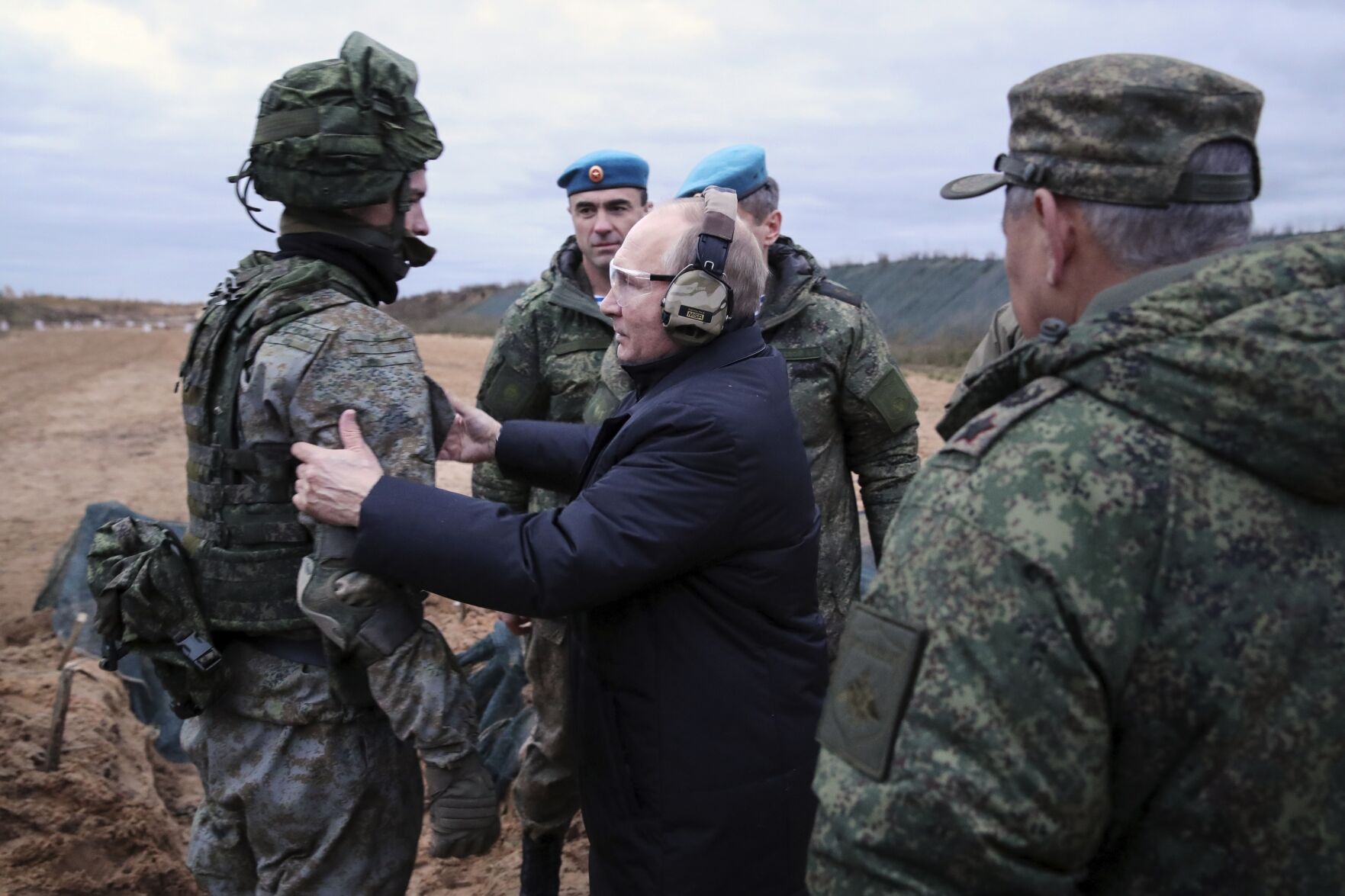 <p>Russian President Vladimir Putin, center, speaks to a soldier as he visits a military training center of the Western Military District for mobilized reservists Oct. 20, 2022, in the Ryazan region of Russia.</p>