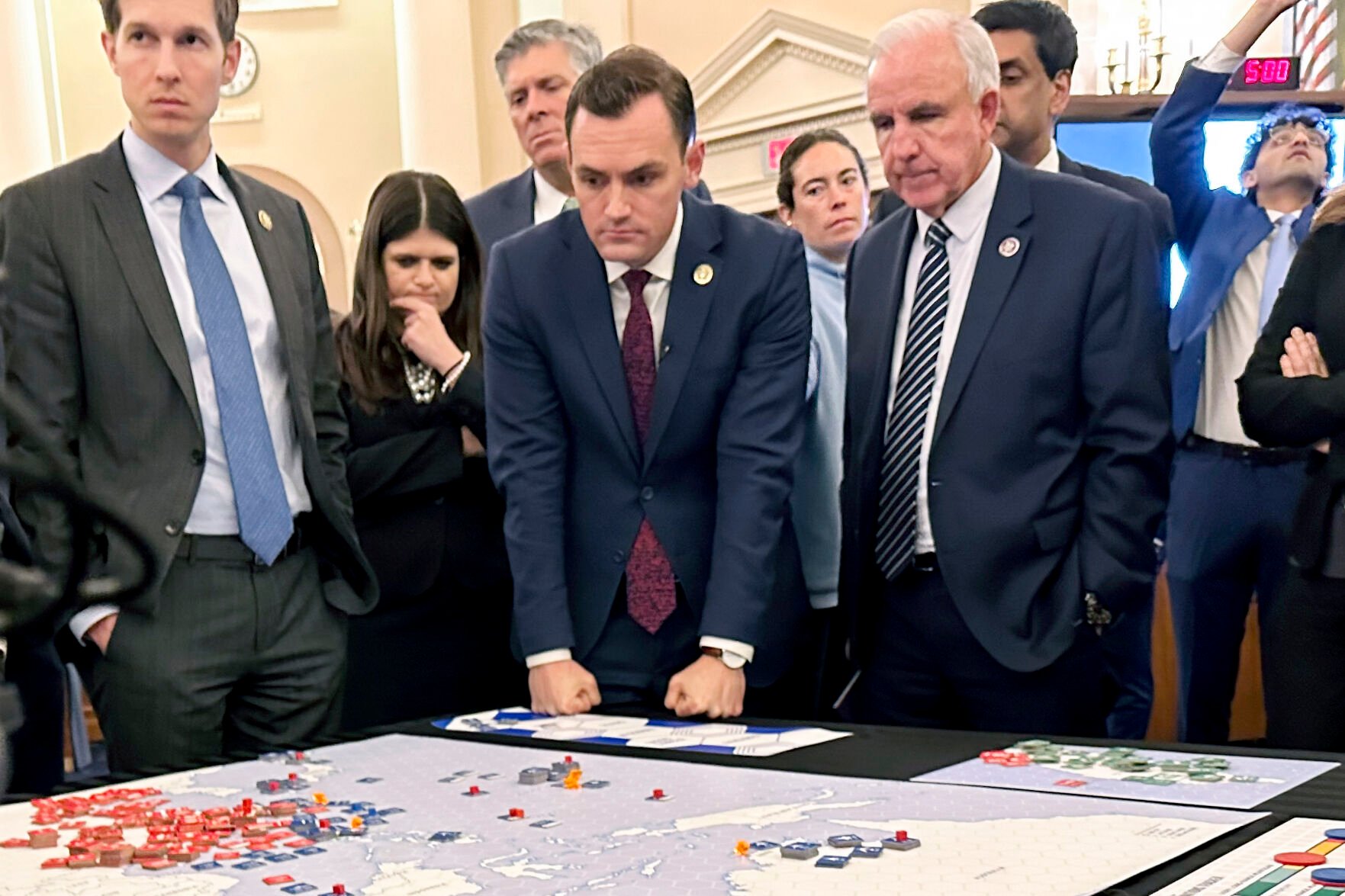 <p>Lawmakers in a new House select committee on China from left, Rep. Jake Auchincloss, D-Mass.; Rep. Haley Stevens, D-Mich.; Chairman Rep. Mike Gallagher, R-Wis., and Rep. Carlos Gimenez, R-Fla., gather for a tabletop war game exercise in the House Ways and Means Committee room Wednesday in Washington.</p>