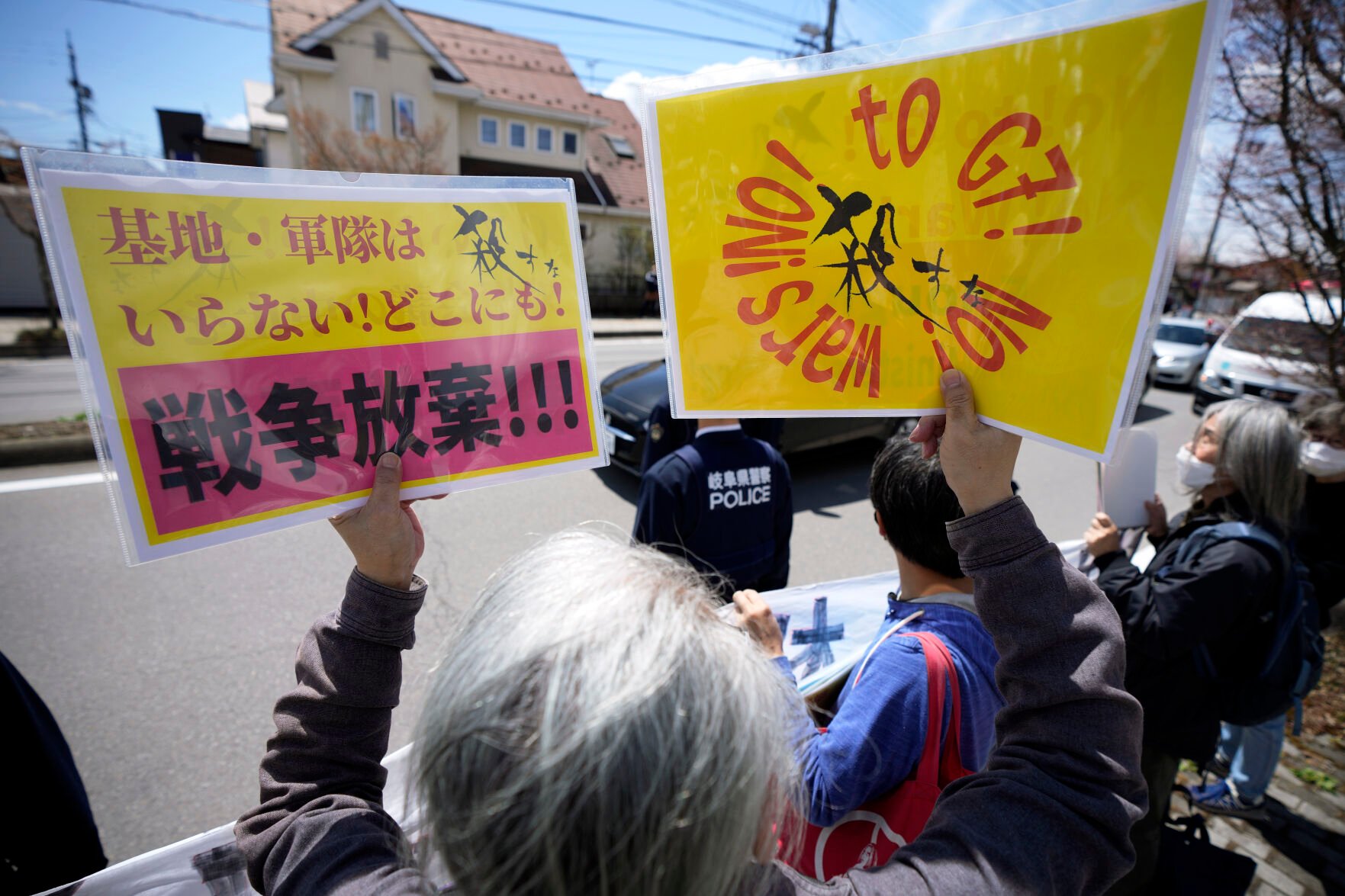 <p>A demonstrator holds banners that read "No need base and military anywhere. No Wars" to protest ahead of the G7 Foreign Ministers' Meeting on Sunday near Karuizawa station in Karuizawa, a resort town north of Tokyo.</p>