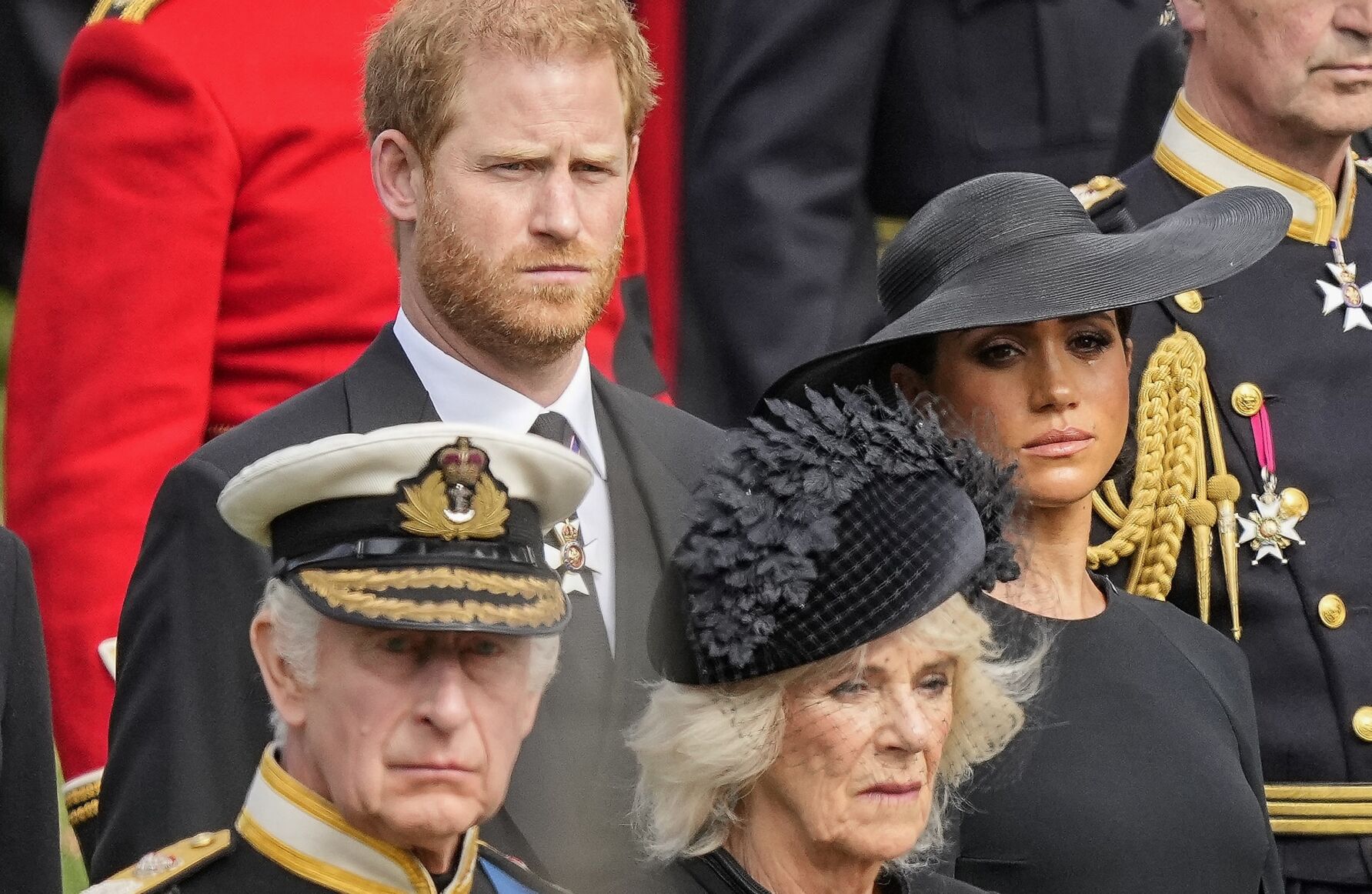 <p>FILE - Britain's King Charles III, from bottom left, Camilla, the Queen Consort, Prince Harry and Meghan, Duchess of Sussex watch as the coffin of Queen Elizabeth II is placed into the hearse following the state funeral service in Westminster Abbey in central London Monday Sept. 19, 2022. King Charles III will hope to keep a lid on those tensions when his royally blended family joins as many as 2,800 guests for the new king’s coronation on May 6 at Westminster Abbey. All except Meghan, the Duchess of Sussex, who won’t be attending.</p>