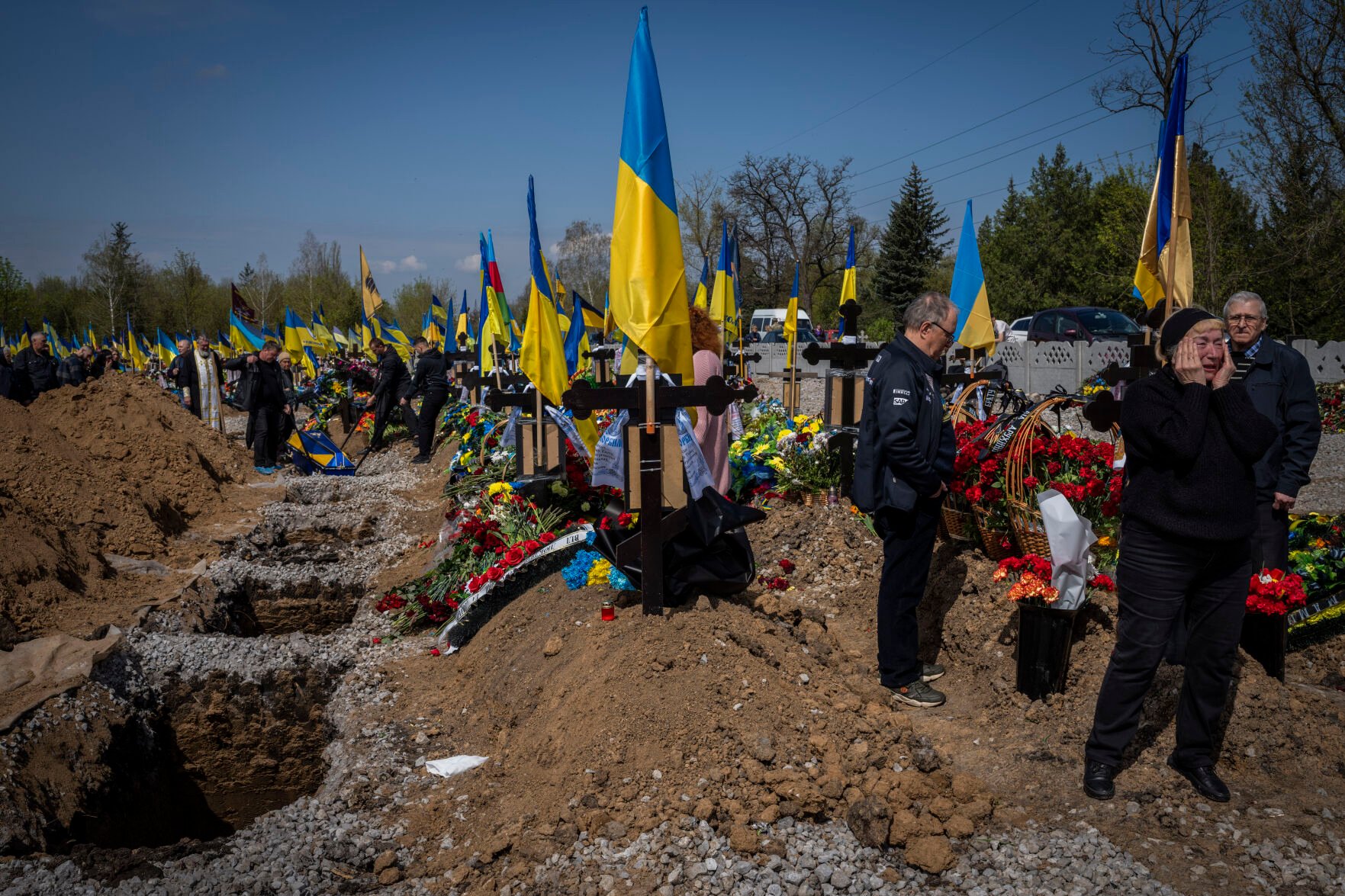 <p>Undertakers lower the coffin of Ukrainian serviceman Andrii Vorobiov on Monday at the Kryvyi Rih cemetery in eastern Ukraine.</p>