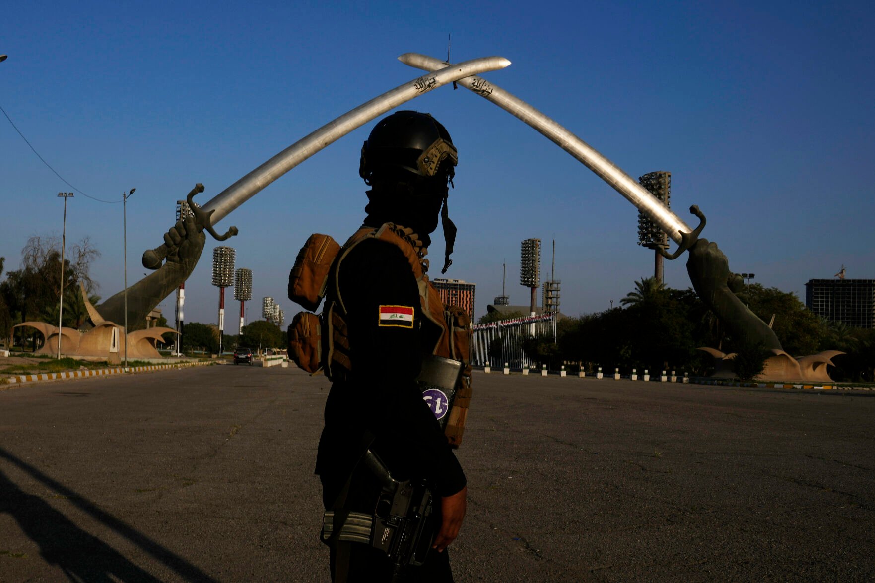 <p>An Iraqi soldier passes under the Victory Arch monument built by former Iraqi President Saddam Hussein Feb. 28 in Baghdad.</p>