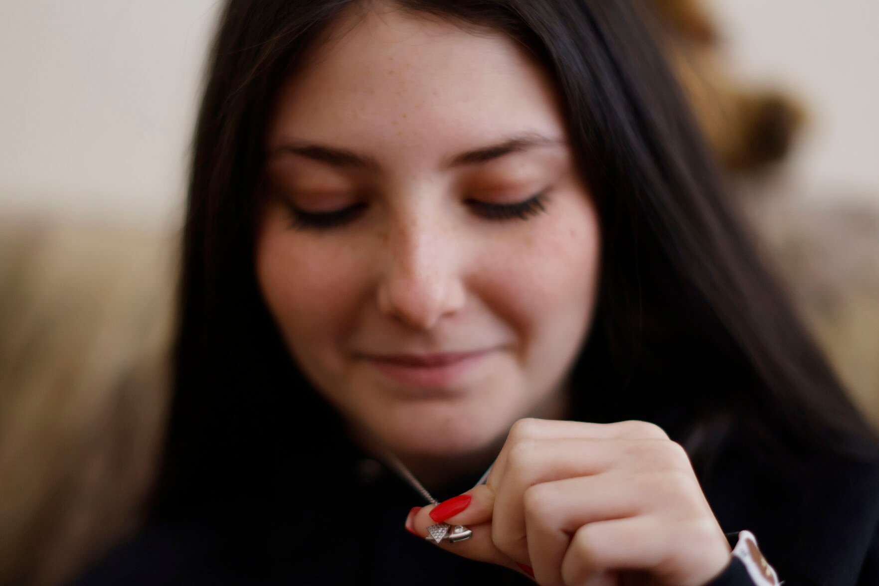 <p>Holocaust survivor Assia Gorban's granddaughter Ruth Gorban shows her necklace with a Star of David during an interview with The Associated Press on April 3 in Berlin, Germany.</p>