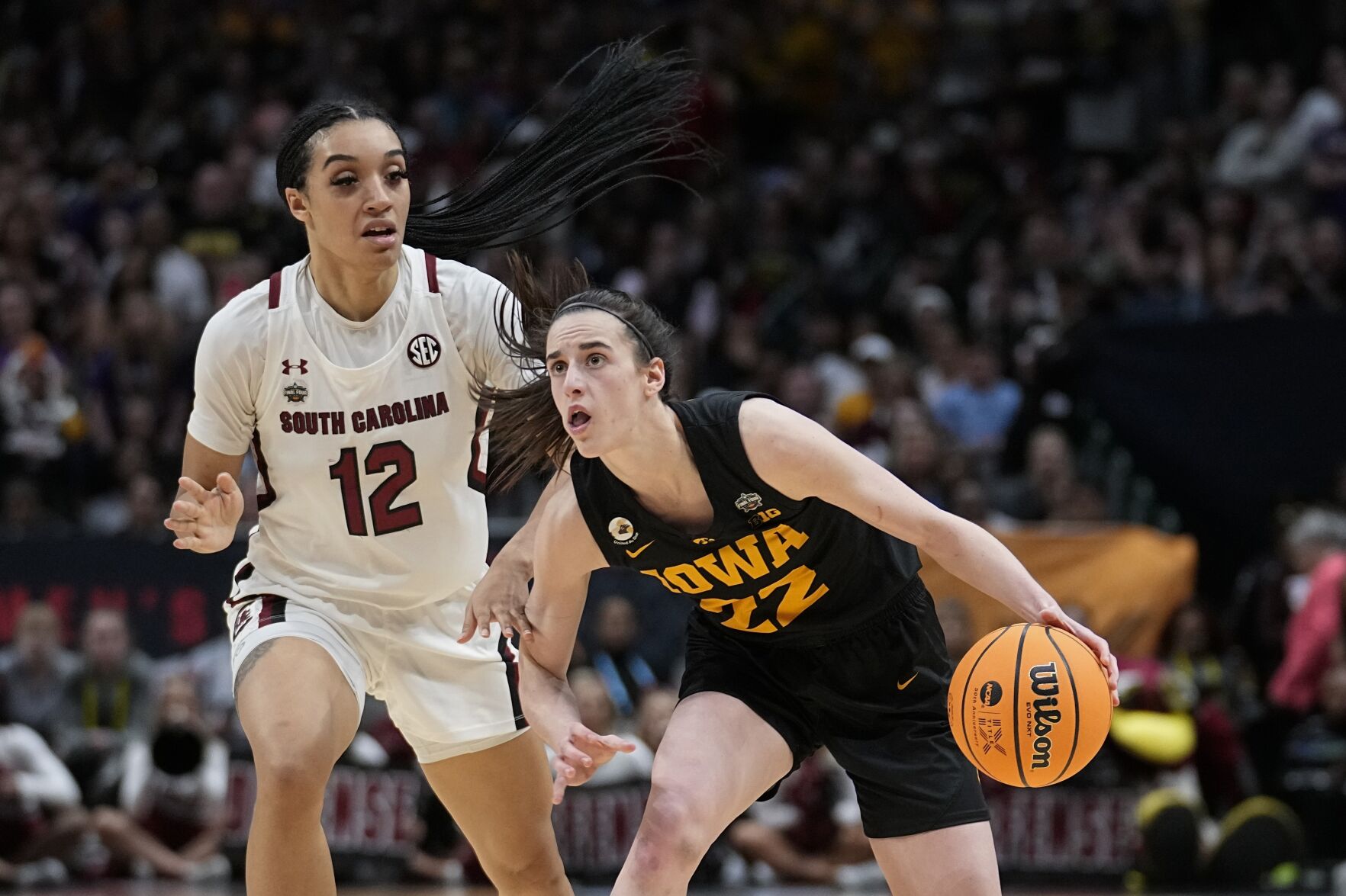 <p>Iowa's Caitlin Clark is fouled by South Carolina's Brea Beal during the second half of Friday's Final Four game in Dallas.</p>