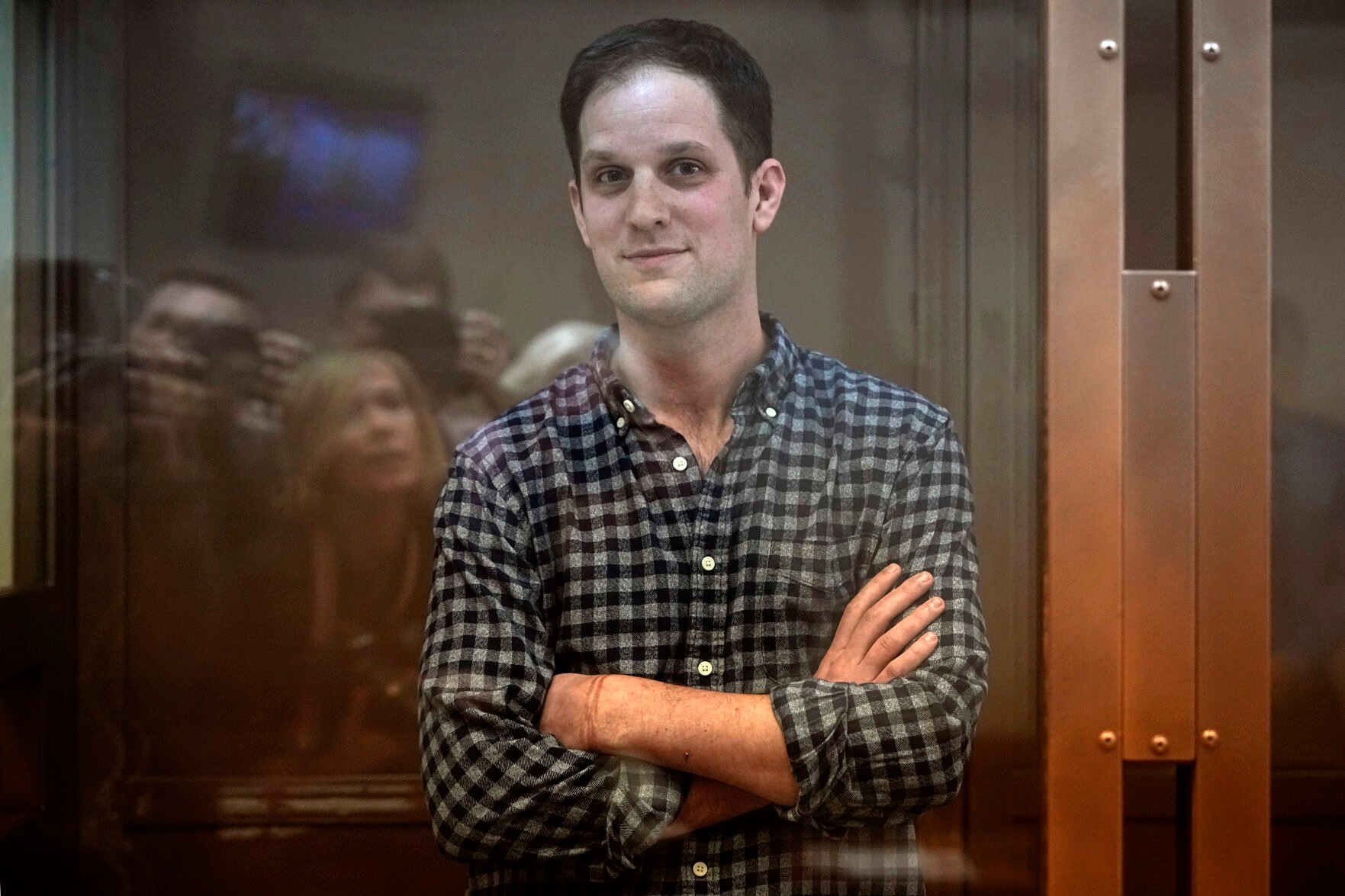 <p>Wall Street Journal reporter Evan Gershkovich stands in a glass cage Tuesday in a courtroom at the Moscow City Court.</p>