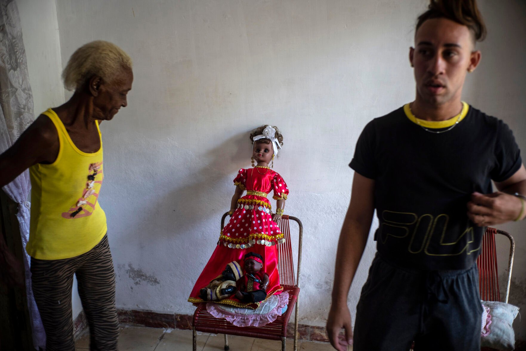 <p>A doll depicting the Yoruba deity Yemayá is propped up on a chair before the start of a Santería ceremony in the home of Mandy Arrazcaeta, on Nov. 13 in Havana, Cuba.</p>