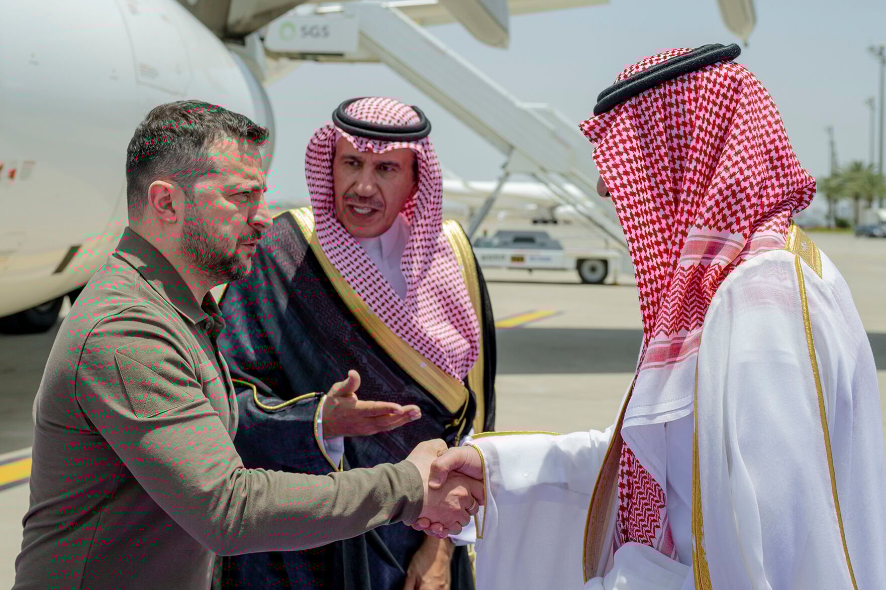 <p>Ukraine's President Volodymyr Zelenskyy, left, is greeted Friday by Prince Badr Bin Sultan, deputy governor of Mecca, upon his arrival at Jeddah airport, Saudi Arabia to attend the Arab summit.</p>