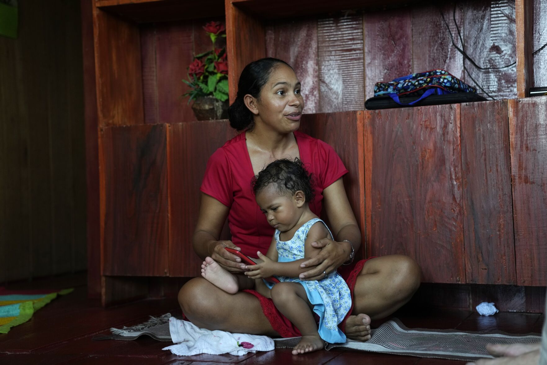 <p>Fernanda de Araujo Moraes, president of the river dwellers' association speaks at her home in Lago Serrado community, near Carauari, Brazil, on Sept. 1, 2022. </p>
