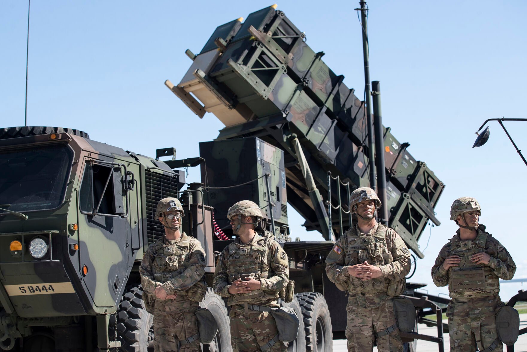 <p>Members of US 10th Army Air and Missile Defense Command stand next to a Patriot surface-to-air missile battery July 20, 2017, during a NATO exercise at the Siauliai airbase east of Vilnius, Lithuania.</p>