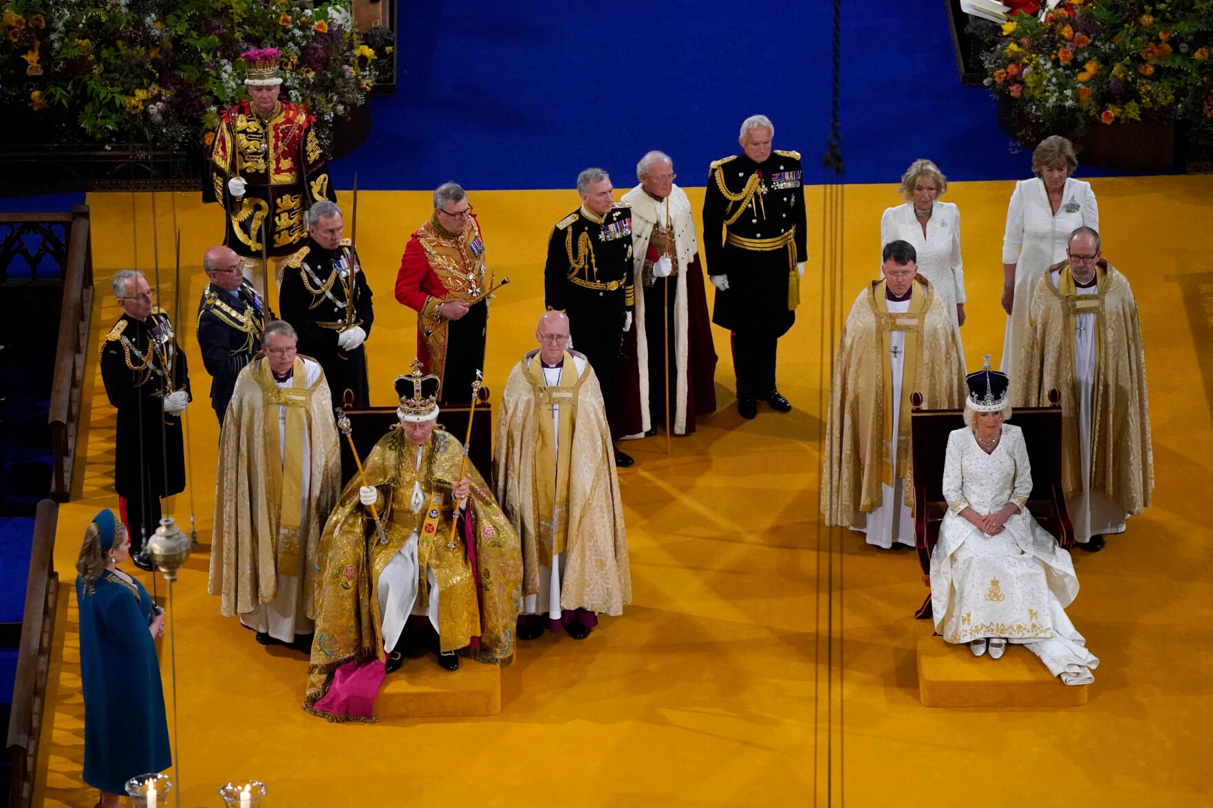 <p>King Charles III wearing the St Edward's Crown and Queen Camilla wearing the Queen Mary's Crown sit during the coronation ceremony at Westminster Abbey, in London, Saturday May 6, 2023. (Andrew Matthews/Pool via AP)</p>