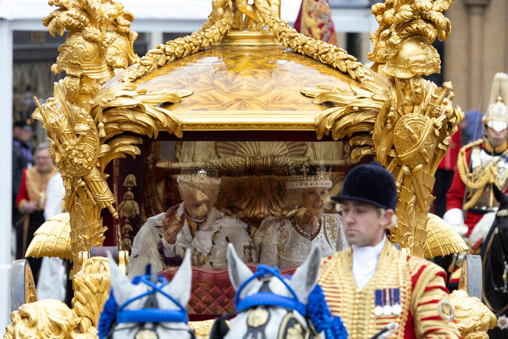 <p>Britain's King Charles III and Queen Camilla leave Westminster Abbey after their coronation ceremony Saturday in London.</p>