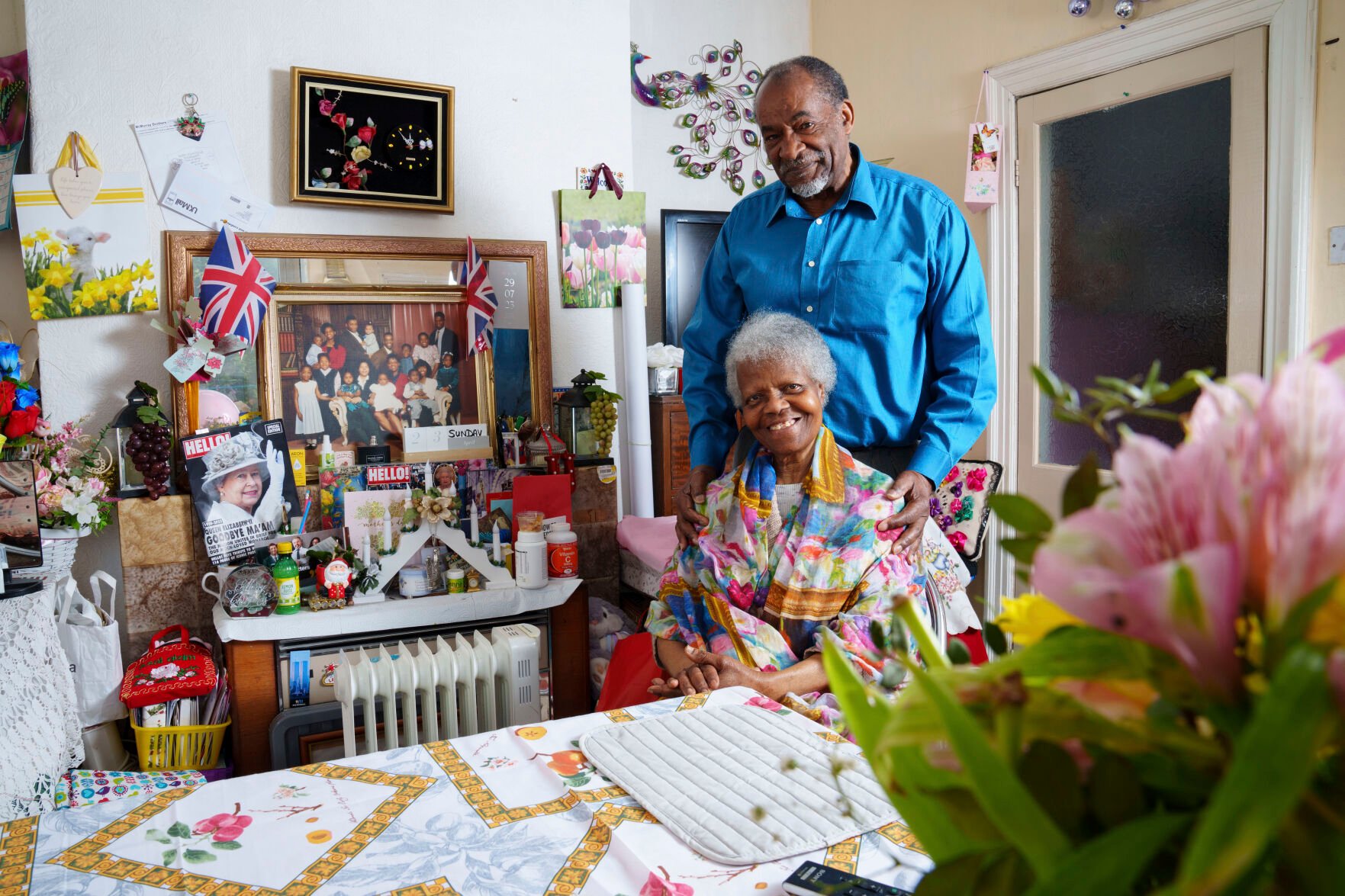<p>Sylius and Bridgette Toussaint pose for a photo April 25 at their home in Preston, England. The Toussaints will be watching Saturday as King Charles III is crowned.</p>