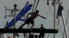 Contestants Slip And Stumble During Annual Greasy Pole Competition In Massachusetts