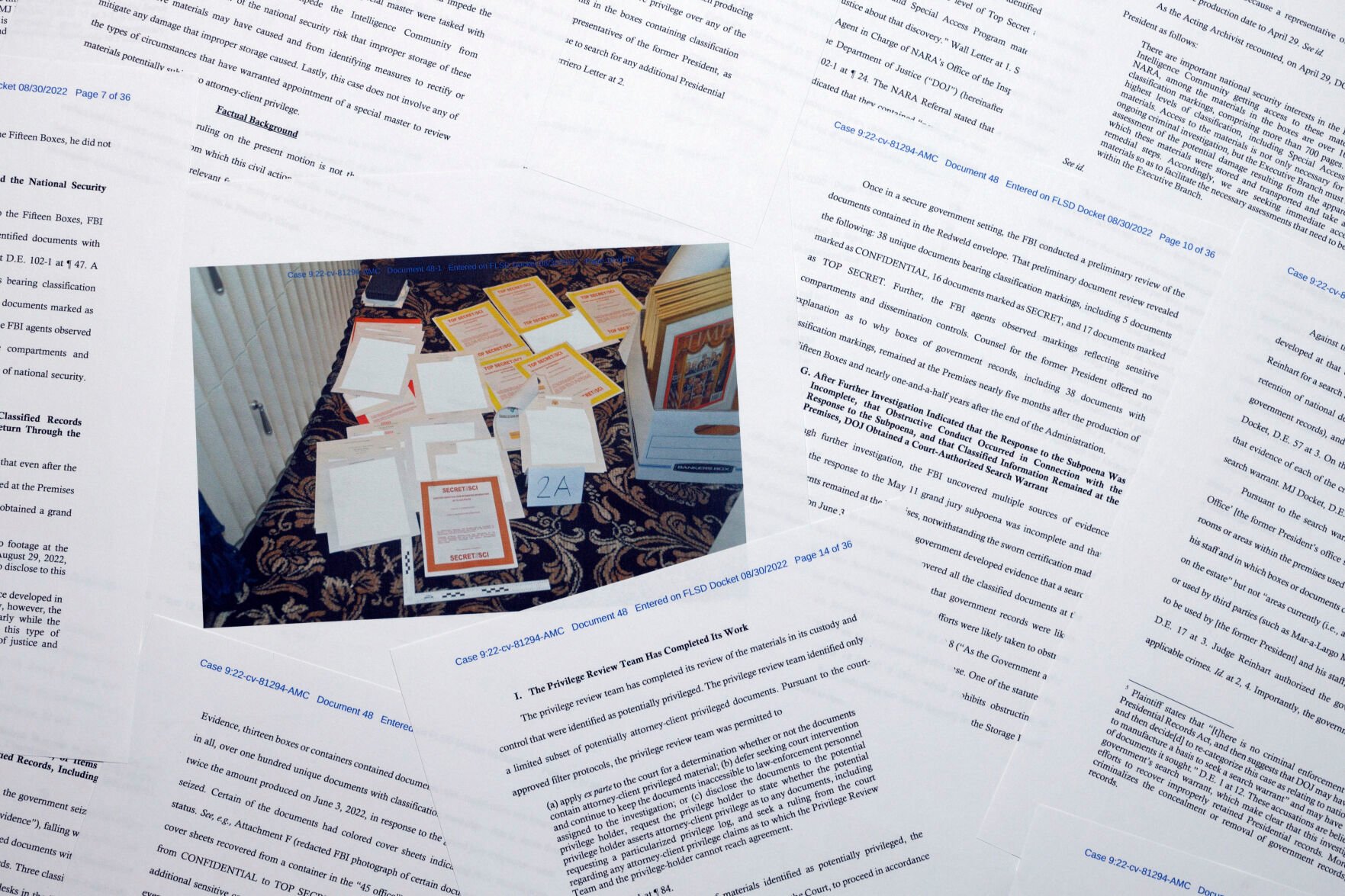 <p>Pages from a Department of Justice court filing on Aug. 30, 2022, in response to a request from the legal team of former President Donald Trump for a special master to review the documents seized during the Aug. 8 search of Mar-a-Lago, are photographed early Aug. 31, 2022. </p>