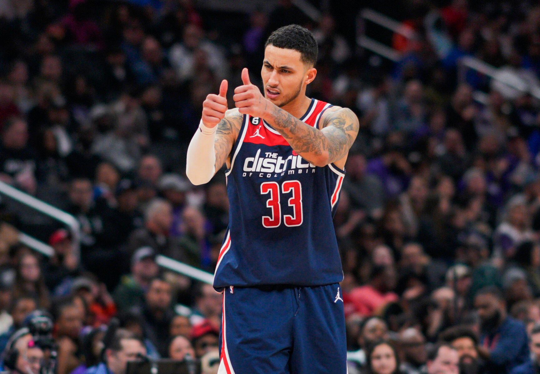 <p>Washington Wizards forward Kyle Kuzma gestures to teammates during the a March 18 game against the Sacramento Kings in Washington.</p>