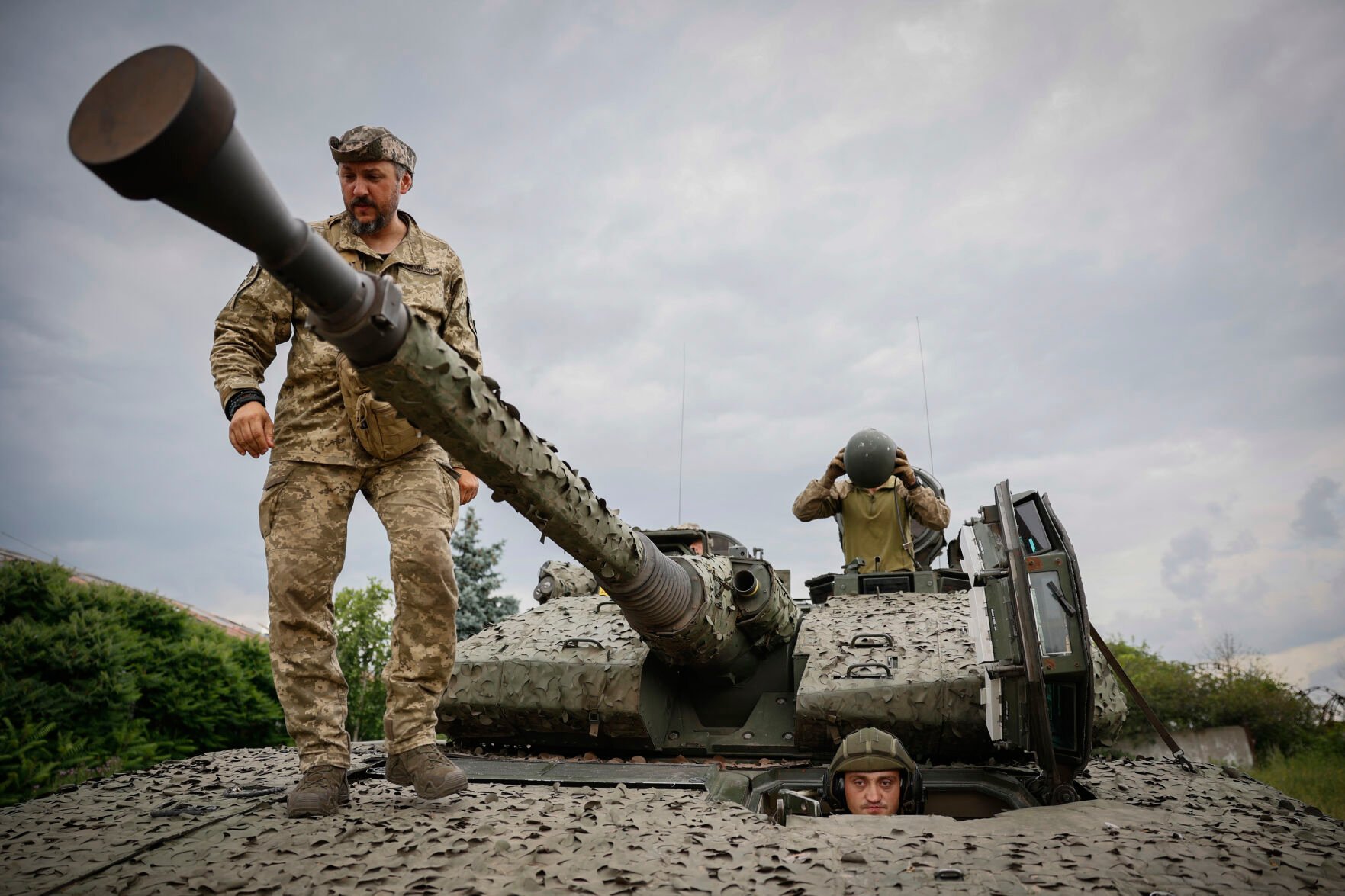 <p>Ukrainian soldiers on a Swedish CV90 infantry fighting vehicle June 25 at their positions near Bakhmut, Donetsk region, Ukraine.</p>