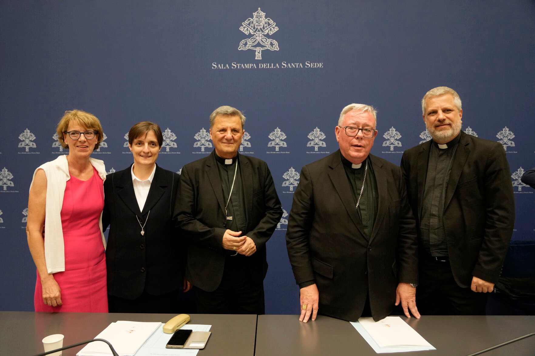 <p>From left, Helena Jeppesen Spuhler, Sister Nadia Coppa, Secretary General of the Synod of Bishops Cardinal Mario Grech, Cardinal Jean-Claude Hollerich and Father Giacomo Costa pose for photographers at the end of a presentation of the new guidelines for the Synod of Bishops at the Vatican, Tuesday.</p>