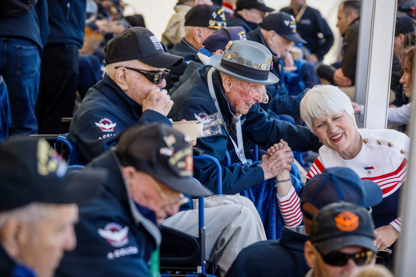 <p>U.S. veteran SSgt. Jake M. Larson poses with a woman for a photograph during a gathering in preparation for the 79th D-Day anniversary in La Fiere, Normandy, France, on June 4.</p>