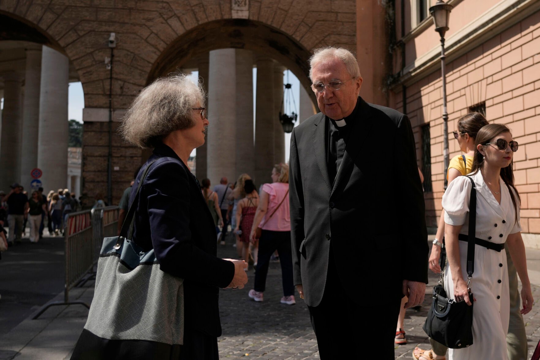 <p>Sister Nathalie Becquart, the first female undersecretary in the Vatican's Synod of Bishops, shares a word with Cardinal Arthur Roche on May 29 on her way to the Vatican.</p>